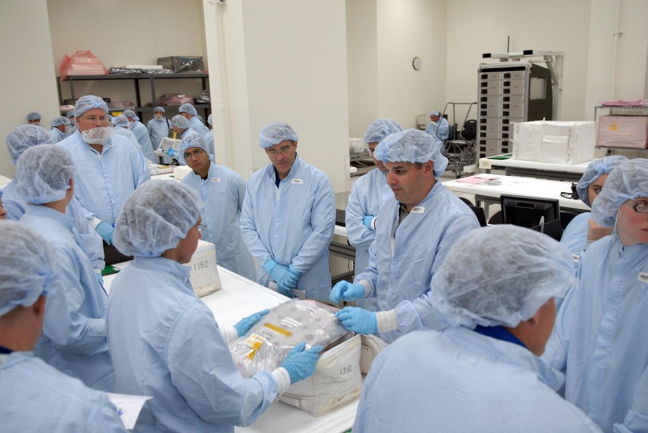 CAPE CANAVERAL, Fla. – In the Space Station Processing Facility at NASA's Kennedy Space Center, members of space shuttle Endeavour's STS-126 crew participate in a crew equipment interface test, or CEIT.  Here, Mission Specialist Sandra Magnus, with glasses, receives guidance from a Kennedy employee, as Mission Specialist Steve Bowen looks on, at center wearing glasses. The CEIT provides hands-on experience with hardware and equipment slated to fly on their mission.  Endeavour will deliver a multi-purpose logistics module to the International Space Station on the STS-126 mission. Launch is targeted for Nov. 10.  Photo credit: NASA/Kim Shiflett