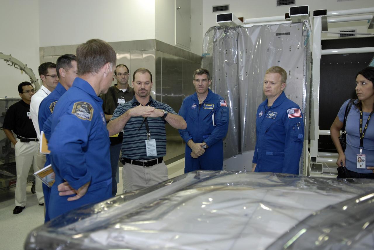 CAPE CANAVERAL, Fla. – In the Space Station Processing Facility at NASA's Kennedy Space Center, members of space shuttle Endeavour's STS-126 crew participate in a crew equipment interface test, or CEIT.  Here, from in the blue flight suits, Commander Chris Ferguson, Mission Specialist Steve Bowen and Pilot Eric Boe receive instruction from a Kennedy employee.  The CEIT provides hands-on experience with hardware and equipment slated to fly on their mission.  Endeavour will deliver a multi-purpose logistics module to the International Space Station on the STS-126 mission. Launch is targeted for Nov. 10.  Photo credit: NASA/Kim Shiflett