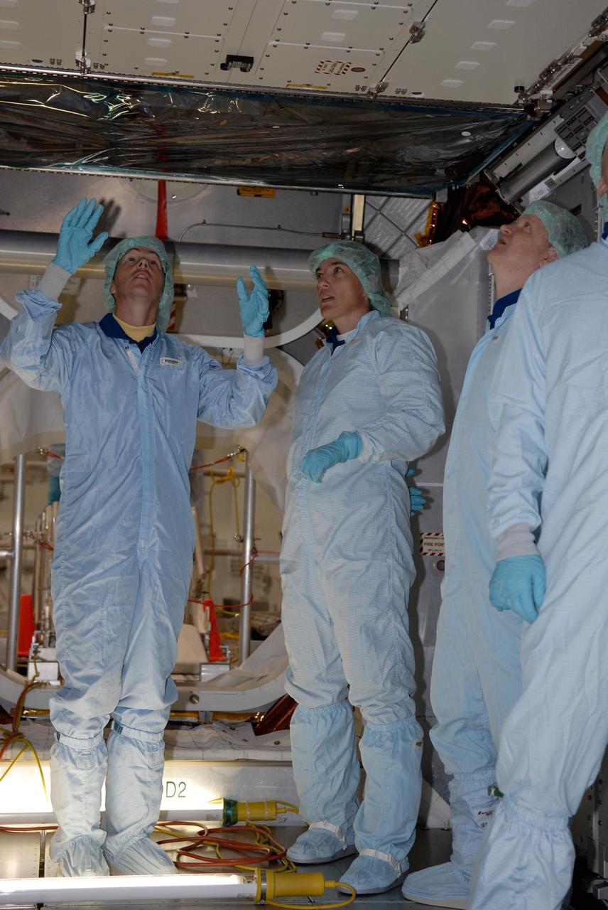 CAPE CANAVERAL, Fla. –  In the Space Station Processing Facility at NASA's Kennedy Space Center, members of space shuttle Endeavour's STS-126 crew participate in a crew equipment interface test, or CEIT.  Here, from left, Mission Specialists Sandra Magnus and Heidemarie Stefanyshyn-Piper, and Pilot Eric Boe are dressed in clean room attire for a walkthrough of the multi-purpose logistics module.  The CEIT provides hands-on experience with hardware and equipment slated to fly on their mission.  Endeavour will deliver a multi-purpose logistics module to the International Space Station on the STS-126 mission. Launch is targeted for Nov. 10.  Photo credit: NASA/Kim Shiflett