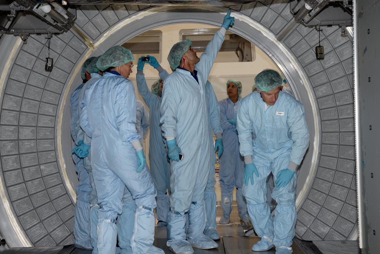 CAPE CANAVERAL, Fla. – In the Space Station Processing Facility at NASA's Kennedy Space Center, members of space shuttle Endeavour's STS-126 crew participate in a crew equipment interface test, or CEIT.  Here, from left, Mission Specialists Sandra Magnus and Donald Pettit, and Commander Chris Ferguson are dressed in clean room attire for a walkthrough of the multi-purpose logistics module.  The CEIT provides hands-on experience with hardware and equipment slated to fly on their mission.  Endeavour will deliver a multi-purpose logistics module to the International Space Station on the STS-126 mission. Launch is targeted for Nov. 10.  Photo credit: NASA/Kim Shiflett