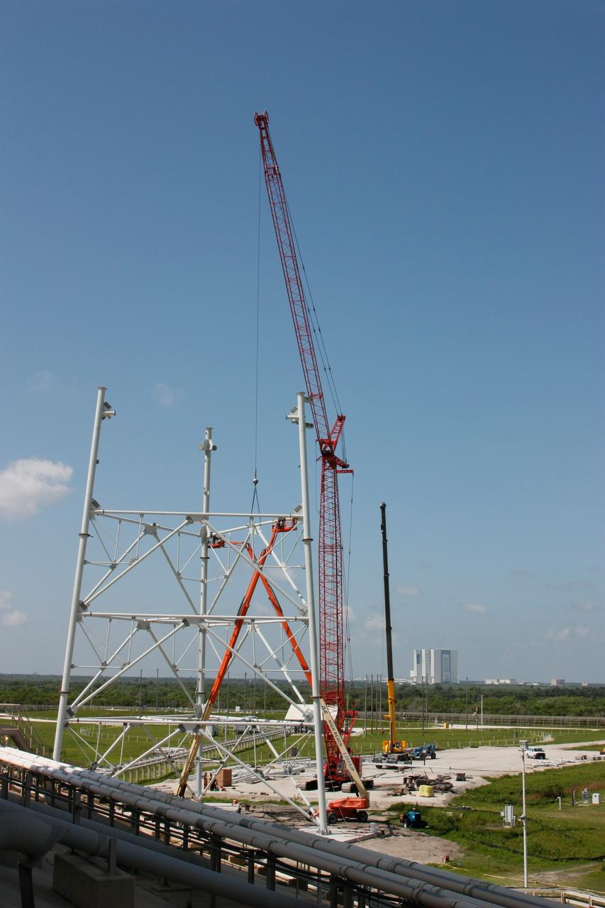 CAPE CANAVERAL, Fla. –   On Launch Pad 39B at NASA's Kennedy Space Center, lightning towers are being constructed to hold centenary wires as part of the new lightning protection system for the Constellation Program and Ares/Orion launches. Pad B will be the site of the first Ares vehicle launch, including Ares I-X which is scheduled for April 2009. Photo credit: NASA/Jim Grossmann