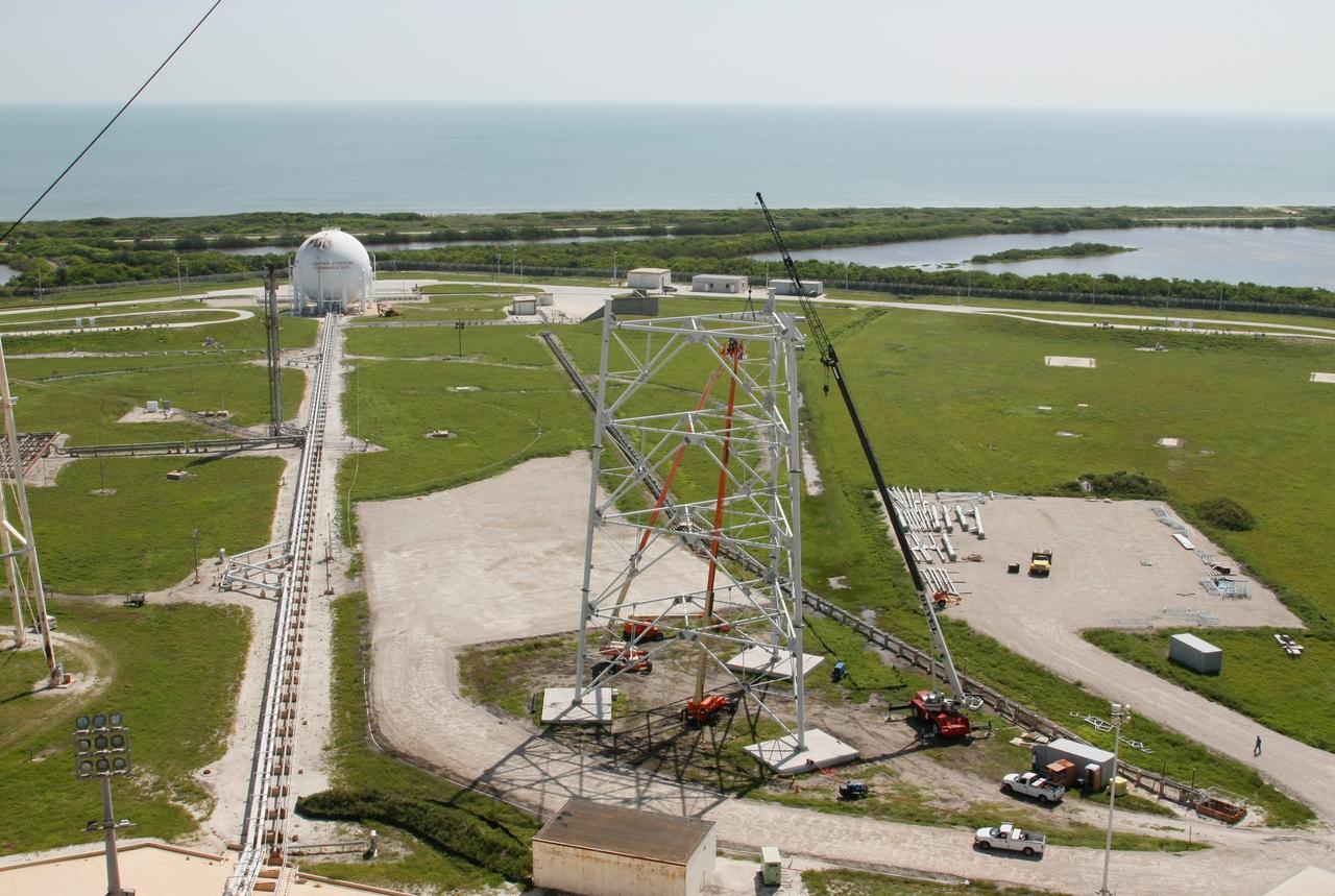 CAPE CANAVERAL, Fla. –   On Launch Pad 39B at NASA's Kennedy Space Center, lightning towers are being constructed to hold centenary wires as part of the new lightning protection system for the Constellation Program and Ares/Orion launches.  Pad B will be the site of the first Ares vehicle launch, including Ares I-X which is scheduled for April 2009. Photo credit: NASA/Jim Grossmann