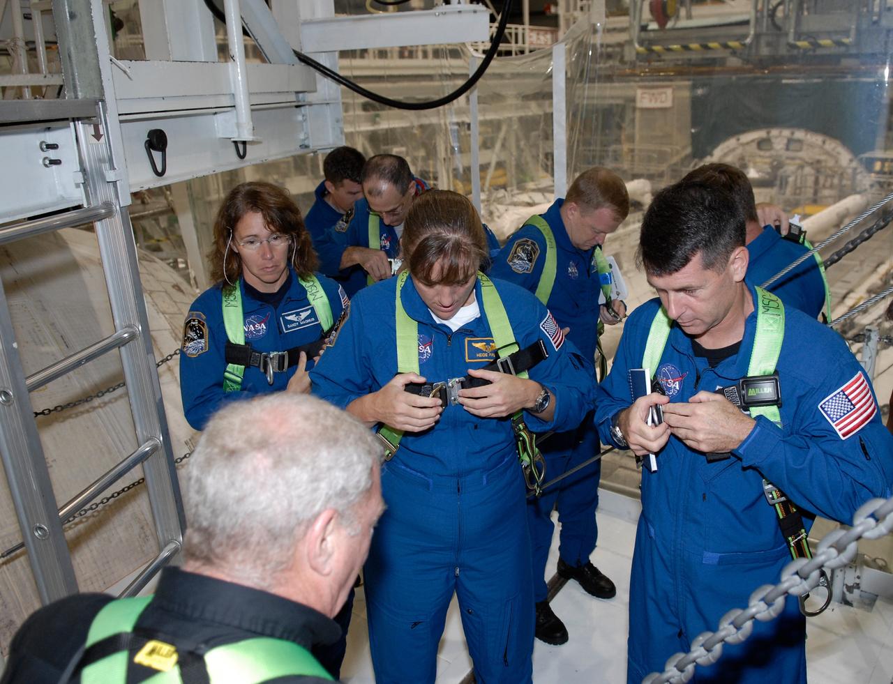 CAPE CANAVERAL, Fla. – In Orbiter Processing Facility 2 at NASA's Kennedy Space Center, members of space shuttle Endeavour's STS-126 crew participate in a crew equipment interface test, or CEIT. From left in the blue flight suits are International Space Station Expedition 18 flight engineer Sandra Magnus, Mission Specialist Heidemarie Stefanyshyn-Piper, Pilot Eric Boe and Mission Specialist Shane Kimbrough. The CEIT provides hands-on experience with hardware and equipment slated to fly on their mission. Endeavour will deliver a multi-purpose logistics module to the International Space Station on the STS-126 mission. Launch is targeted for Nov. 10. Photo credit: NASA/Kim Shiflett