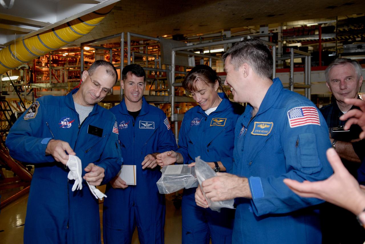 CAPE CANAVERAL, Fla. – In Orbiter Processing Facility 2 at NASA's Kennedy Space Center, members of space shuttle Endeavour's STS-126 crew participate in a crew equipment interface test, or CEIT. From left in the blue flight suits are Mission Specialists Donald Pettit, Shane Kimbrough, Heidemarie Stefanyshyn-Piper and Steve Bowen. The CEIT provides hands-on experience with hardware and equipment slated to fly on their mission. Endeavour will deliver a multi-purpose logistics module to the International Space Station on the STS-126 mission. Launch is targeted for Nov. 10. Photo credit: NASA/Kim Shiflett