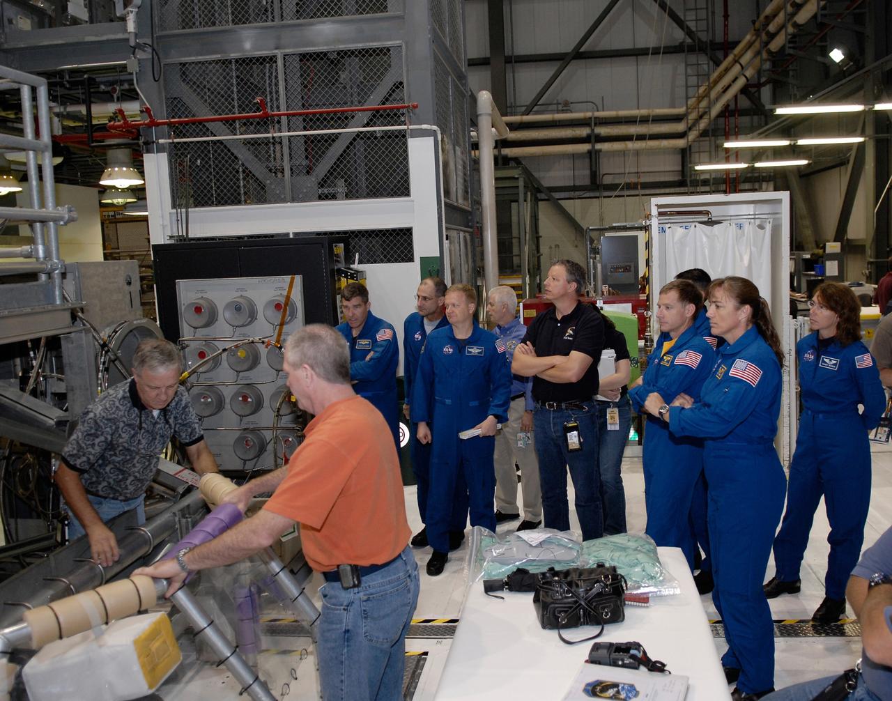 CAPE CANAVERAL, Fla. – In Orbiter Processing Facility 2 at NASA's Kennedy Space Center, members of space shuttle Endeavour's STS-126 crew participate in a crew equipment interface test, or CEIT. From left in the blue flight suits are Mission Specialists Steve Bowen and Donald Pettit, Pilot Eric Boe, Commander Chirs Ferguson, Mission Specialist Heidemarie Stefanyshyn-Piper and International Space Station Expedition 18 flight engineer Sandra Magnus. The CEIT provides hands-on experience with hardware and equipment slated to fly on their mission. Endeavour will deliver a multi-purpose logistics module to the International Space Station on the STS-126 mission. Launch is targeted for Nov. 10. Photo credit: NASA/Kim Shiflett