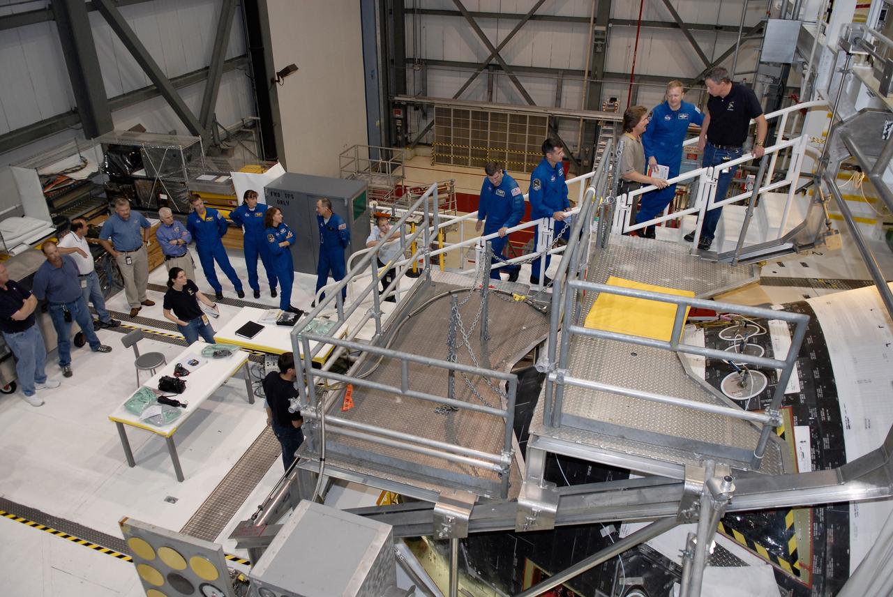 CAPE CANAVERAL, Fla. – In Orbiter Processing Facility 2 at NASA's Kennedy Space Center, members of space shuttle Endeavour's STS-126 crew participate in a crew equipment interface test, or CEIT. From left in the blue flight suits are Commander Chirs Ferguson; Mission Specialist Heidemarie Stefanyshyn-Piper; International Space Station Expedition 18 flight engineer Sandra Magnus; Mission Specialists Donald Pettit, Steve Bowen and Shane Kimbrough; and Pilot Eric Boe. The CEIT provides hands-on experience with hardware and equipment slated to fly on their mission. Endeavour will deliver a multi-purpose logistics module to the International Space Station on the STS-126 mission. Launch is targeted for Nov. 10. Photo credit: NASA/Kim Shiflett