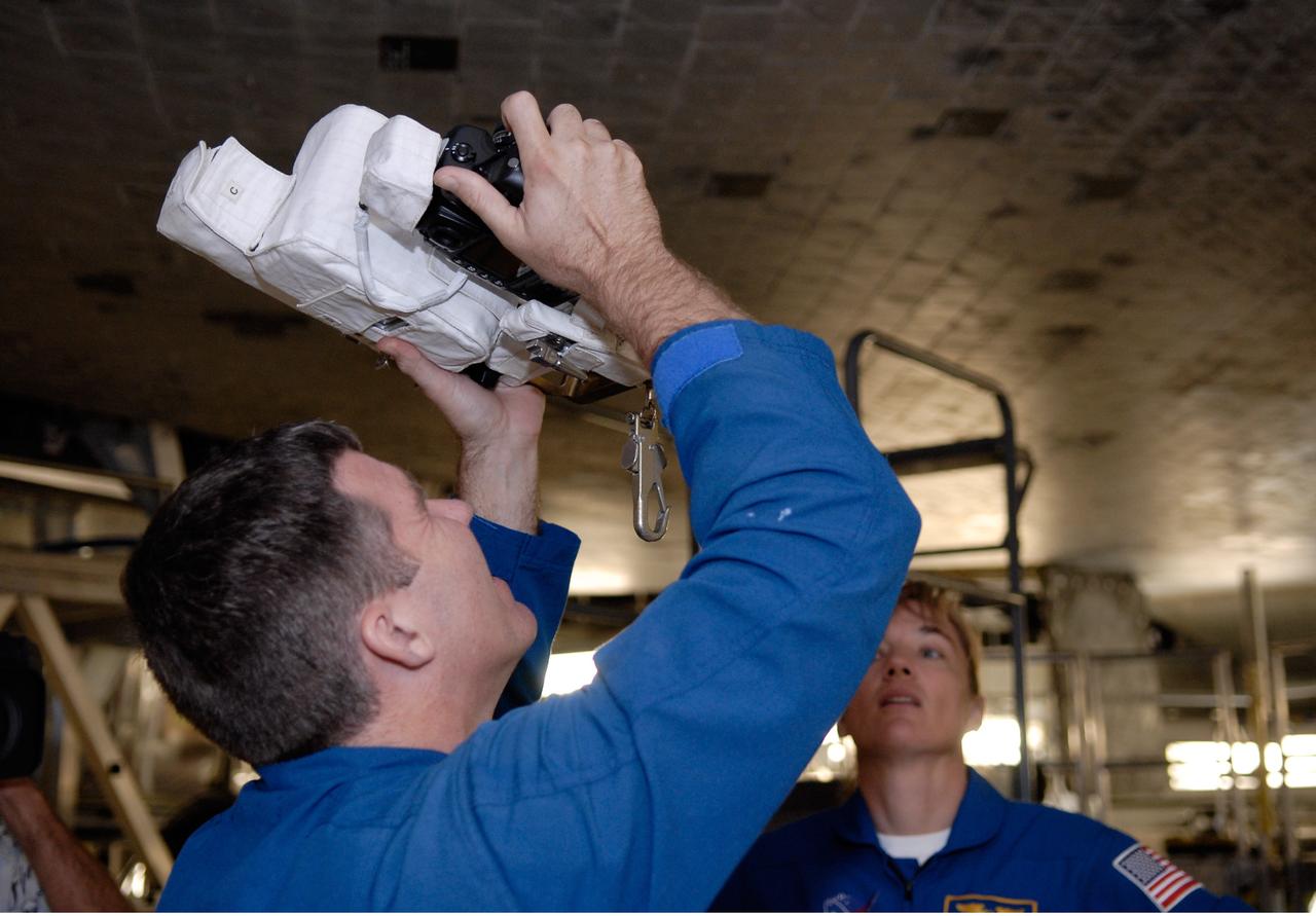 CAPE CANAVERAL, Fla. – In Orbiter Processing Facility 2 at NASA's Kennedy Space Center, members of space shuttle Endeavour's STS-126 crew participate in a crew equipment interface test, or CEIT. From left are Mission Specialists Steve Bowen and Heidemarie Stefanyshyn-Piper. The CEIT provides hands-on experience with hardware and equipment slated to fly on their mission. Endeavour will deliver a multi-purpose logistics module to the International Space Station on the STS-126 mission. Launch is targeted for Nov. 10. Photo credit: NASA/Kim Shiflett