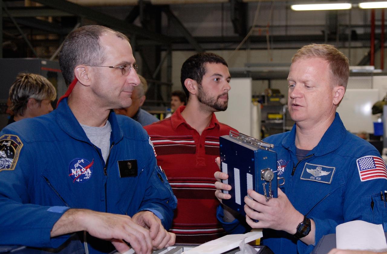 CAPE CANAVERAL, Fla. – In Orbiter Processing Facility 2 at NASA's Kennedy Space Center, members of space shuttle Endeavour's STS-126 crew participate in a crew equipment interface test, or CEIT. From left are Mission Specialist Donald Pettit and Pilot Eric Boe. The CEIT provides hands-on experience with hardware and equipment slated to fly on their mission. Endeavour will deliver a multi-purpose logistics module to the International Space Station on the STS-126 mission. Launch is targeted for Nov. 10. Photo credit: NASA/Kim Shiflett