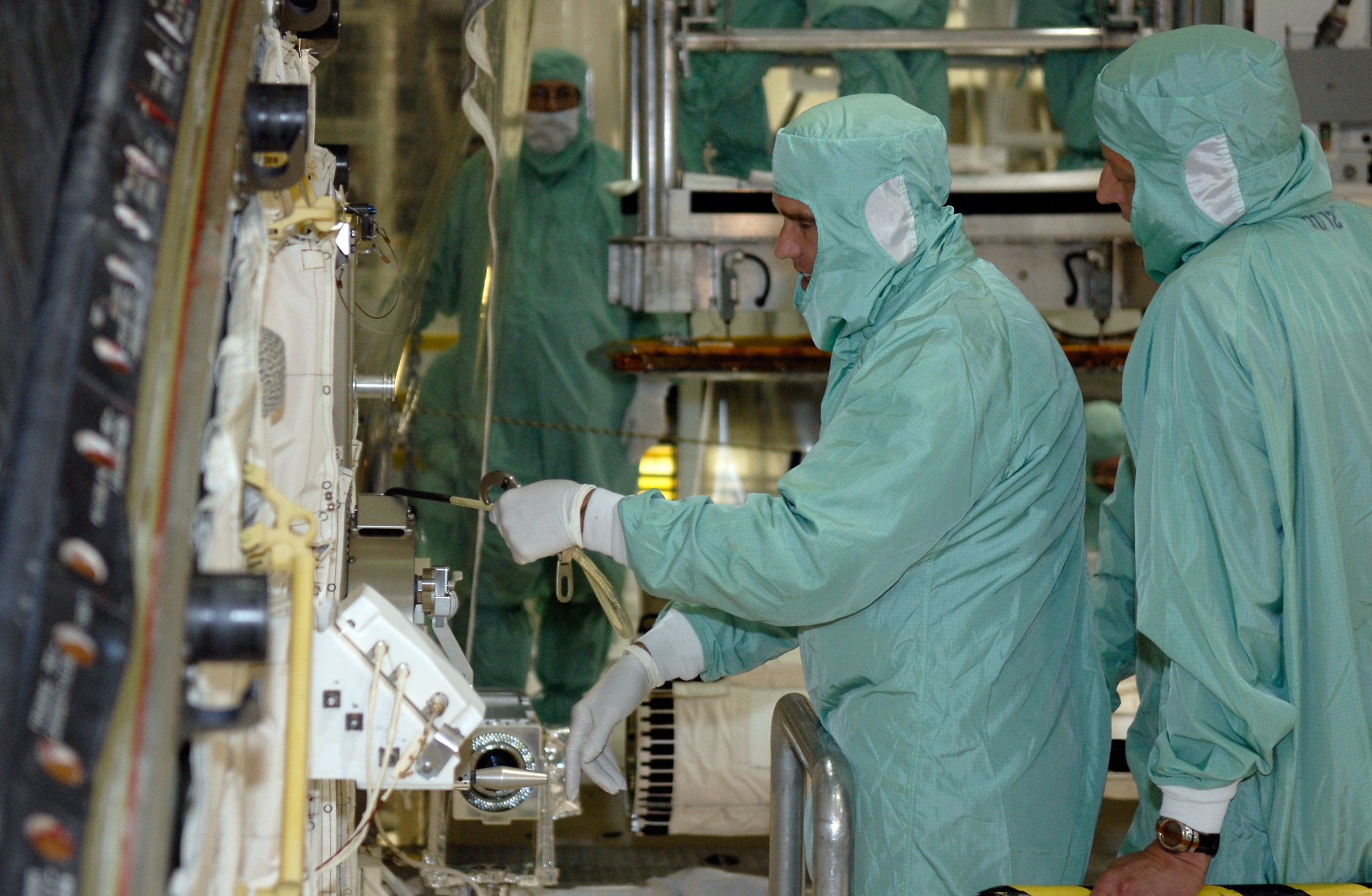 CAPE CANAVERAL, Fla. –  In Orbiter Processing Facility 2 at NASA's Kennedy Space Center, STS-126 Mission Specialist Steve Bowen (left) checks hardware in the space shuttle Endeavour's payload bay.  Members of space shuttle Endeavour's STS-126 crew are at Kennedy to participate in a crew equipment interface test, or CEIT.  The CEIT provides experience handling tools, equipment and hardware they will use on the mission. Endeavour will deliver a multi-purpose logistics module to the International Space Station on the STS-126 mission. Launch is targeted for Nov. 10.  Photo credit: NASA/Kim Shiflett