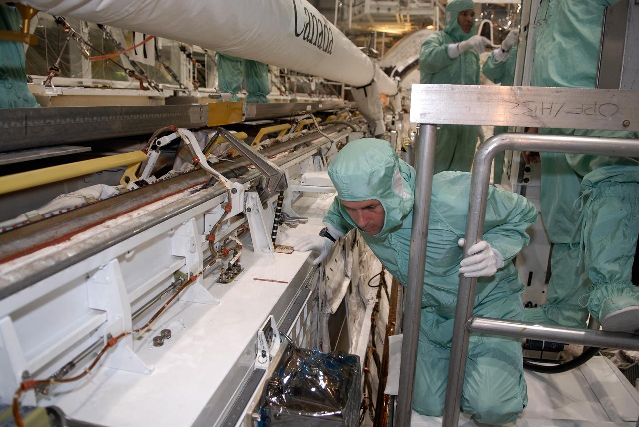 CAPE CANAVERAL, Fla. –  In Orbiter Processing Facility 2 at NASA's Kennedy Space Center, STS-126 Mission Specialist Shane Kimbrough gets a closer look at hardware inside space shuttle Endeavour's payload bay.  Members of space shuttle Endeavour's STS-126 crew are at Kennedy to participate in a crew equipment interface test, or CEIT.  The CEIT provides experience handling tools, equipment and hardware they will use on the mission. Endeavour will deliver a multi-purpose logistics module to the International Space Station on the STS-126 mission. Launch is targeted for Nov. 10.  Photo credit: NASA/Kim Shiflett