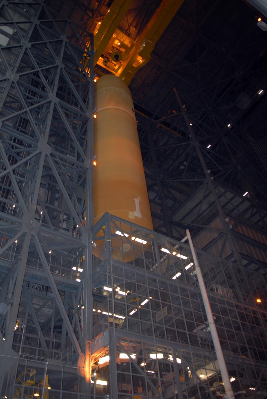 CAPE CANAVERAL, Fla. – In the Vehicle Assembly Building at NASA's Kennedy Space Center, the external tank for space shuttle Atlantis is lifted out of the checkout cell.  The tank will be moved to high bay 3 and lowered toward the solid rocket boosters for mating.  The tank and boosters will be secured on the mobile launcher platform below.  Atlantis' STS-125 mission is the fifth and final shuttle servicing mission to NASA’s Hubble Space Telescope.  Launch is targeted for Oct. 8.    Photo credit: NASA/Jack Pfaller