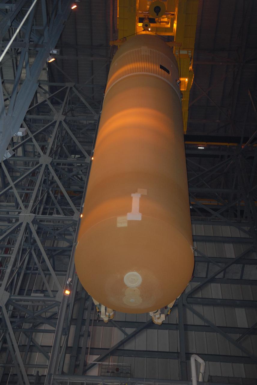 CAPE CANAVERAL, Fla. – In the Vehicle Assembly Building at NASA's Kennedy Space Center, the external tank for space shuttle Atlantis is lifted out of the checkout cell.  The tank will be moved to high bay 3 and lowered toward the solid rocket boosters for mating.  The tank and boosters will be secured on the mobile launcher platform below.  Atlantis' STS-125 mission is the fifth and final shuttle servicing mission to NASA’s Hubble Space Telescope.  Launch is targeted for Oct. 8.    Photo credit: NASA/Jack Pfaller