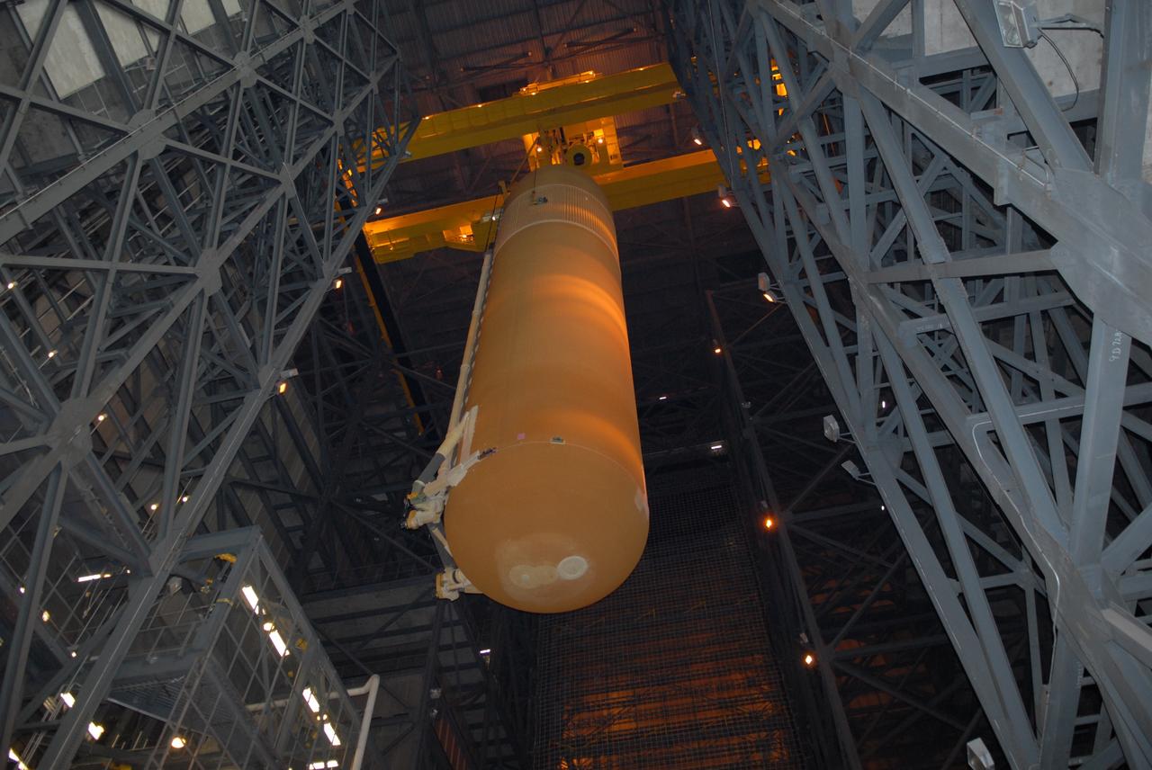 CAPE CANAVERAL, Fla. – In the Vehicle Assembly Building at NASA's Kennedy Space Center, the external tank for space shuttle Atlantis is lifted out of the checkout cell.  The tank will be moved to high bay 3 and lowered toward the solid rocket boosters for mating.  The tank and boosters will be secured on the mobile launcher platform below.  Atlantis' STS-125 mission is the fifth and final shuttle servicing mission to NASA’s Hubble Space Telescope.  Launch is targeted for Oct. 8.    Photo credit: NASA/Jack Pfaller