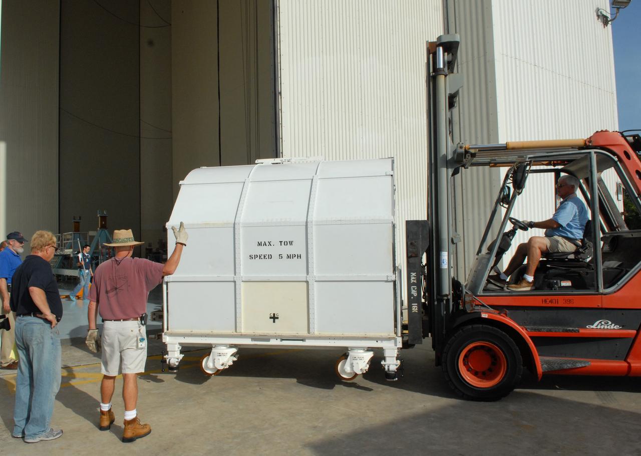 CAPE CANAVERAL, Fla. –   The shipping container holding the Fine Guidance Sensor, or FGS, is moved into the Payload Hazardous Servicing Facility at NASA's Kennedy Space Center.  The FGS will be integrated onto the Orbital Replacement Unit carrier in the clean room of the facility. The sensor will extend the life of the pointing control system on the Hubble Space Telescope. On the mission, this FGS will replace one of the three sensors that is failing and thus outfit the telescope with two completely healthy units, which are needed.  A third, older FGS aboard the telescope will provide additional target-pointing efficiency and redundancy.  Space shuttle Atlantis is targeted to launch on the STS-125 mission Oct. 8.  Photo credit: NASA/Jack Pfaller