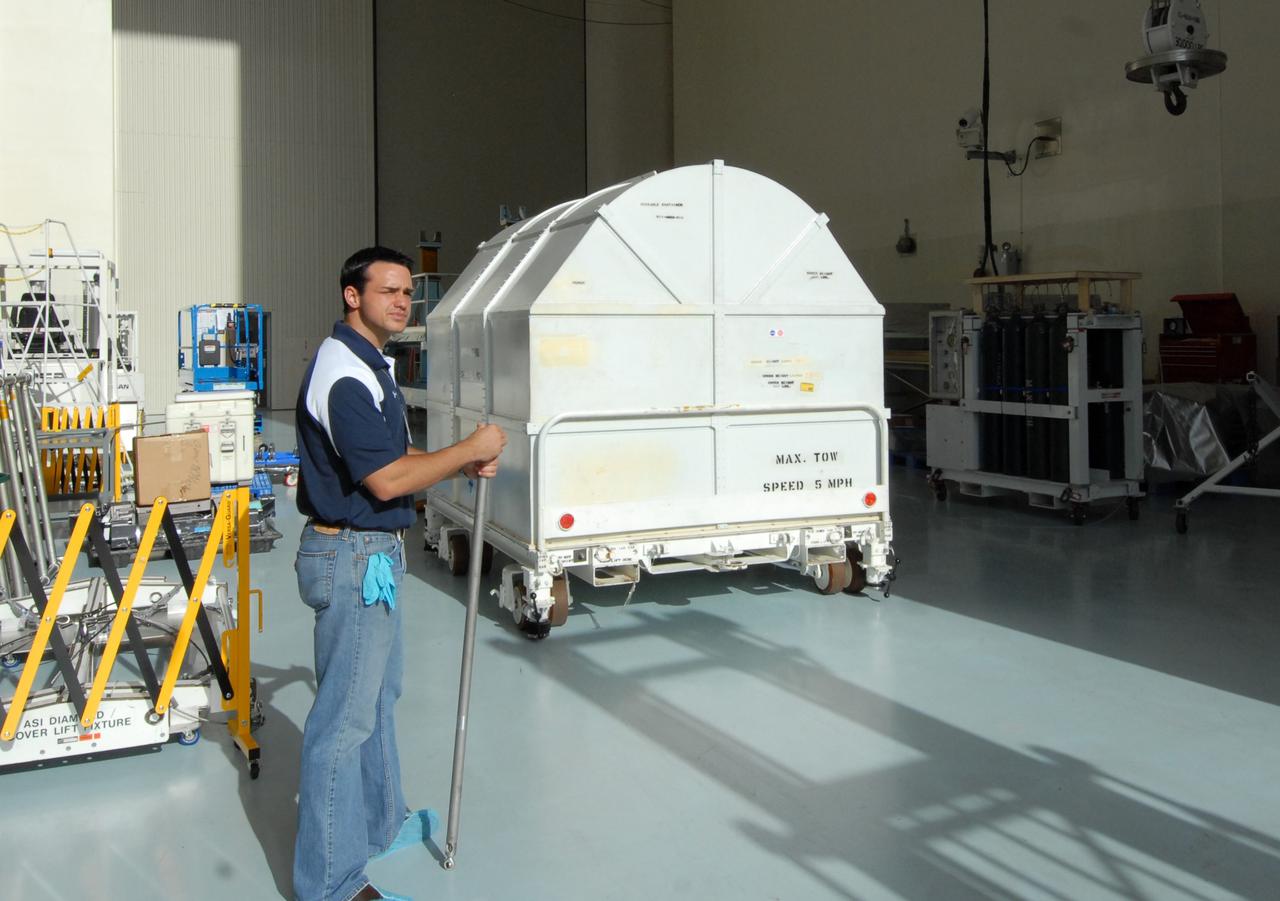 CAPE CANAVERAL, Fla. –   The shipping container holding the Fine Guidance Sensor, or FGS, is moved into the Payload Hazardous Servicing Facility at NASA's Kennedy Space Center.  The FGS will be integrated onto the Orbital Replacement Unit carrier in the clean room of the facility. The sensor will extend the life of the pointing control system on the Hubble Space Telescope. On the mission, this FGS will replace one of the three sensors that is failing and thus outfit the telescope with two completely healthy units, which are needed.  A third, older FGS aboard the telescope will provide additional target-pointing efficiency and redundancy.  Space shuttle Atlantis is targeted to launch on the STS-125 mission Oct. 8.  Photo credit: NASA/Jack Pfaller