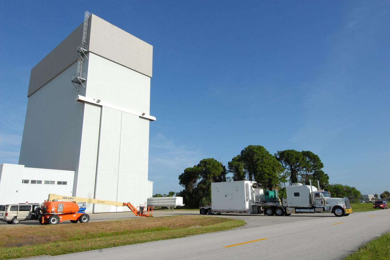 CAPE CANAVERAL, Fla. –   The Multi-Use Lightweight Equipment (MULE) carrier arrives at NASA's Kennedy Space Center for the fifth and final shuttle servicing mission to NASA's Hubble Space Telescope, STS-125. The MULE carrier will join the Flight Support System, the Super Lightweight Interchangeable Carrier and the Orbital Replacement Unit Carrier in the Payload Hazardous Servicing Facility where the Hubble payload is being prepared for launch. The Relative Navigation Sensors and the New Outer Blanket Layers will be on the MULE. The payload is scheduled to go to Launch Pad 39A in mid-September to be installed into Atlantis' payload bay.  Atlantis is targeted to launch Oct. 8 at 1:34 a.m. EDT. .Photo credit: NASA/Amanda Diller