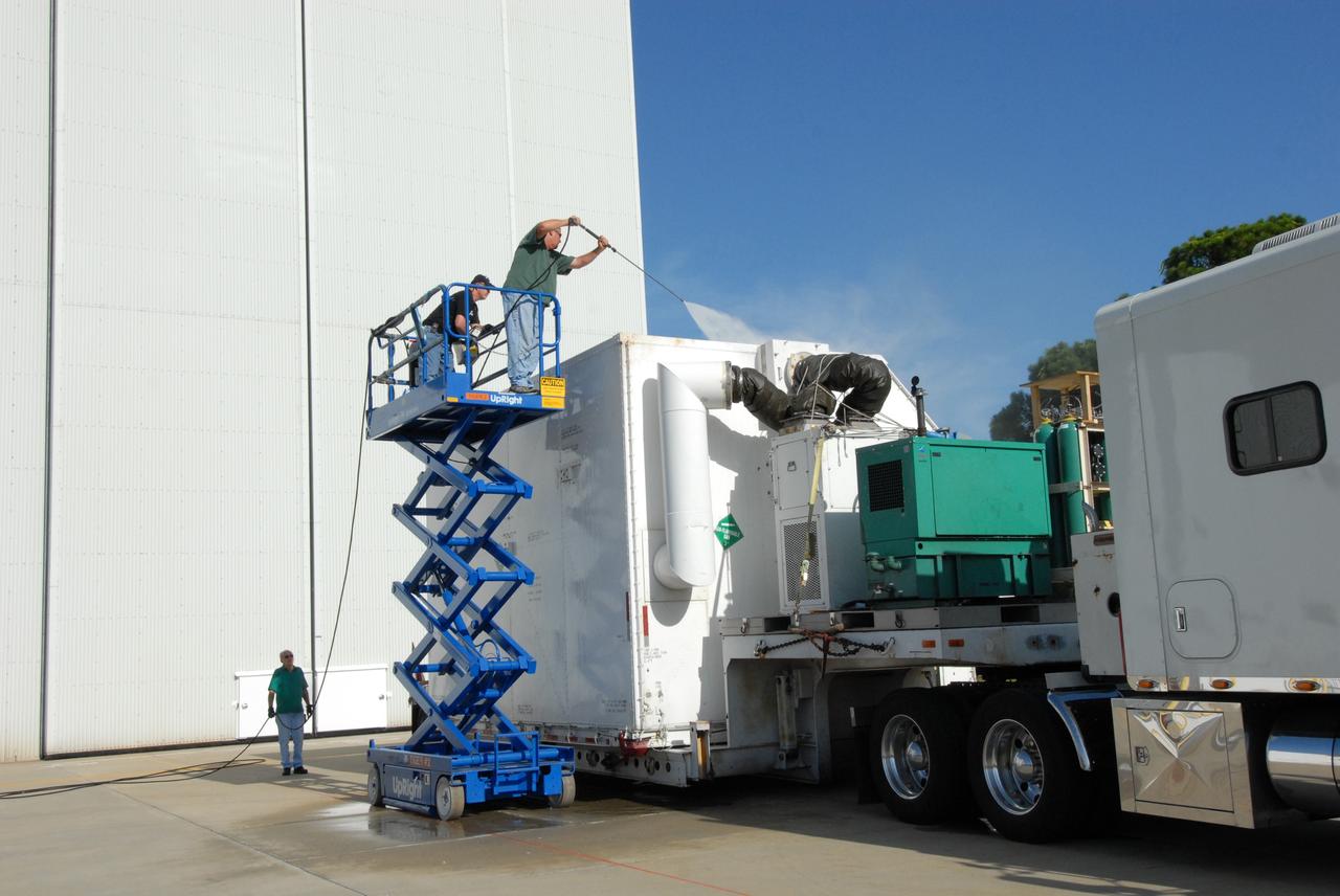 CAPE CANAVERAL, Fla. –   At the Canister Rotation Facility at NASA's Kennedy Space Center, the shipping container with the Multi-Use Lightweight Equipment (MULE) carrier inside is pressure cleaned after its arrival. The MULE is part of the payload for the fifth and final shuttle servicing mission to NASA's Hubble Space Telescope, STS-125. The MULE carrier will join the Flight Support System, the Super Lightweight Interchangeable Carrier and the Orbital Replacement Unit Carrier in the Payload Hazardous Servicing Facility where the Hubble payload is being prepared for launch. The Relative Navigation Sensors and the New Outer Blanket Layers will be on the MULE. The payload is scheduled to go to Launch Pad 39A in mid-September to be installed into Atlantis' payload bay.  Atlantis is targeted to launch Oct. 8 at 1:34 a.m. EDT. .Photo credit: NASA/Amanda Diller
