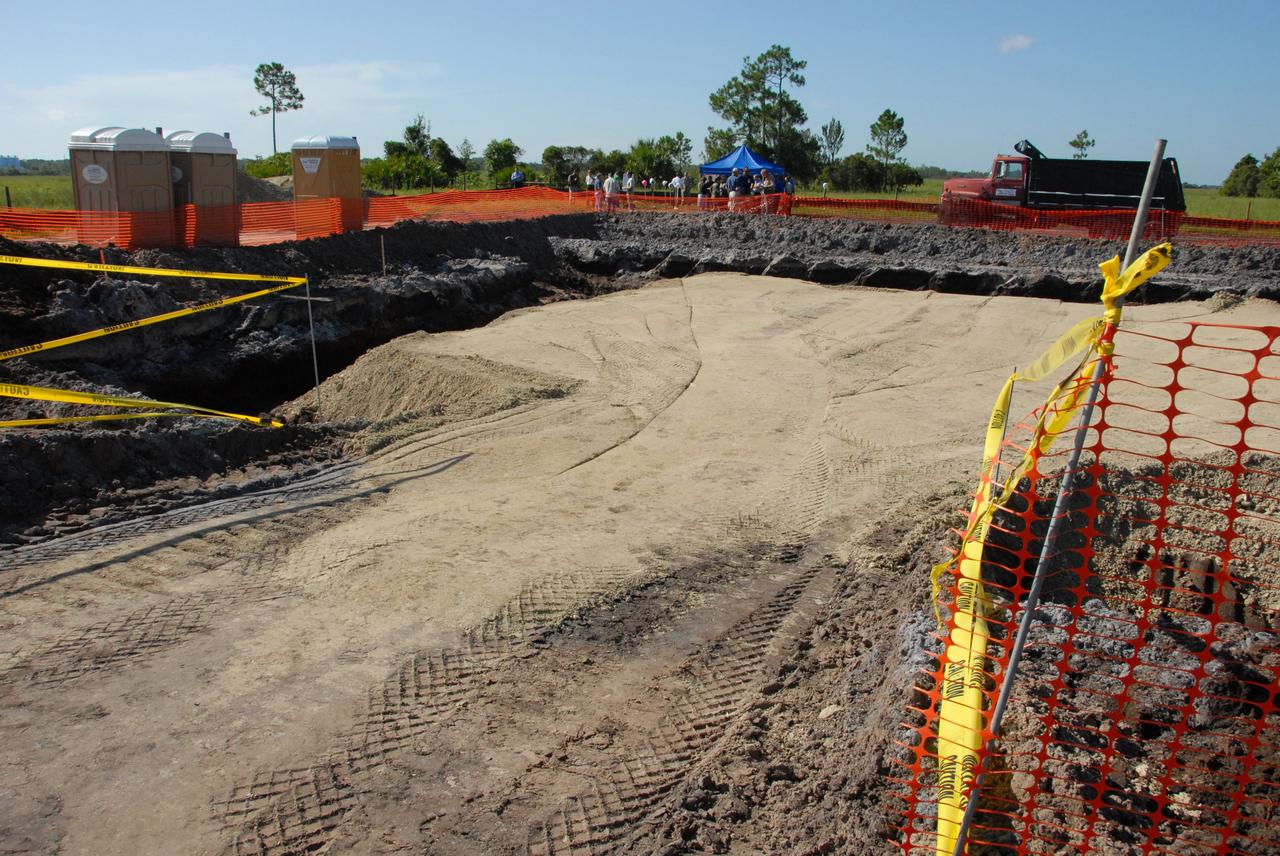 CAPE CANAVERAL, Fla. - The construction site is leveled for a new weather radar to be used by NASA's Kennedy Space Center, the 45th Space Wing and their customers. In the background is the location where a mock ground-breaking ceremony was held. The weather radar is essential in issuing lightning and other severe weather warnings and vital in evaluating lightning launch commit criteria. The new radar, replacing what was installed 25 years ago, includes Doppler capability to detect winds and identify the type, size and number of precipitation particles. The site is ideally distant from the launch pads and has unobstructed views of Cape Canaveral Air Force Station and Kennedy. Photo credit: NASA/Amanda Diller