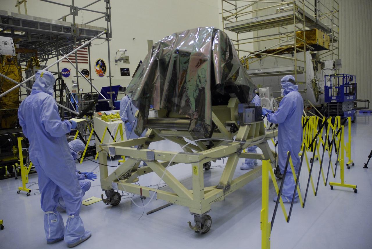 CAPE CANAVERAL, Fla. –   The Fine Guidance Sensor, or FGS, is being prepared for backlight inspection and cleaning in the Payload Hazardous Servicing Facility at NASA's Kennedy Space Center.  The FGS is part of the payload for the fifth and final Hubble servicing mission, STS-125, aboard space shuttle Atlantis.  An FGS consists of a large structure housing a collection of mirrors, lenses, servos, prisms, beam splitters and photomultiplier tubes. There are three fine guidance sensors on Hubble located at 90-degree intervals around the circumference of the telescope. Along with the gyroscopes, the optical sensors are a key component of Hubble’s highly complex but extraordinarily effective “pointing control system.”  Atlantis is targeted to launch Oct. 8. Photo credit: NASA/Jack Pfaller