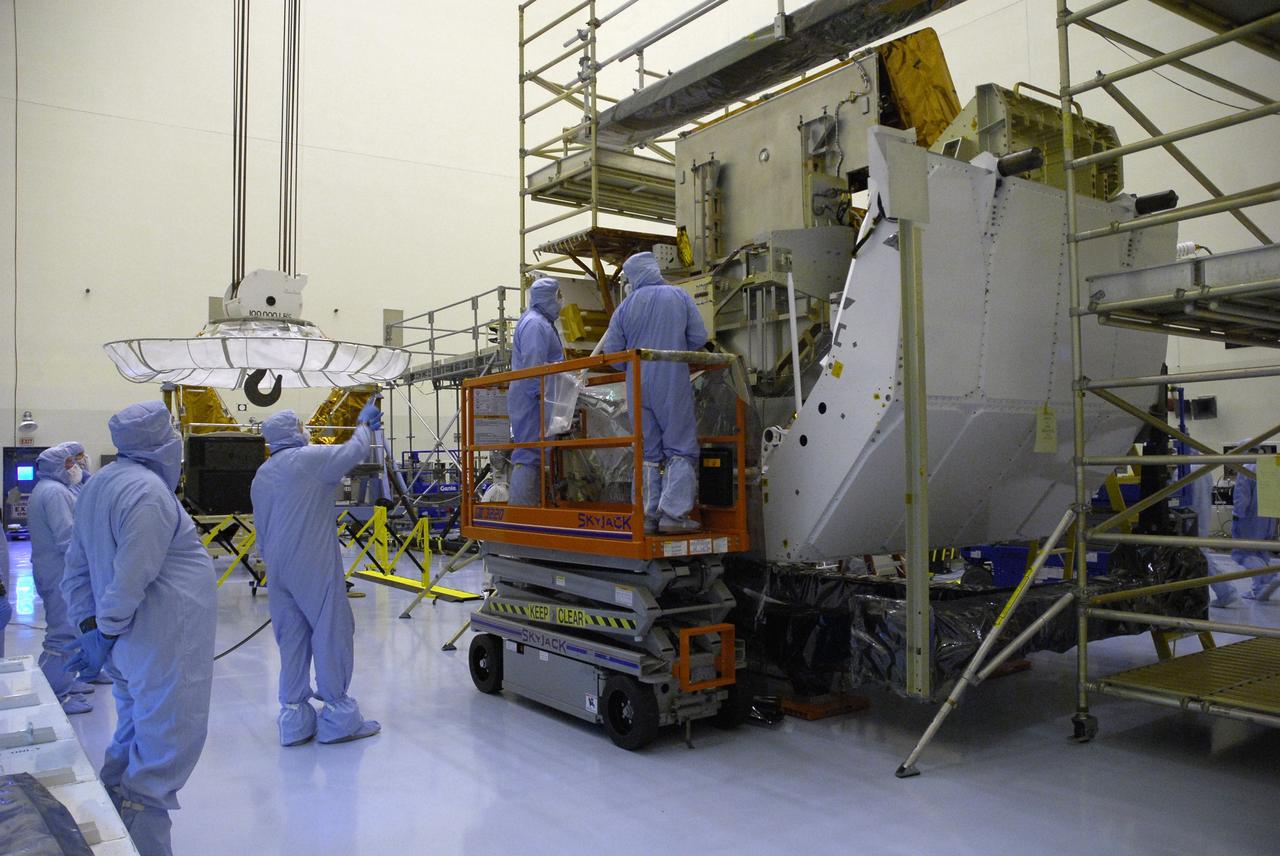 CAPE CANAVERAL, Fla. –   Technicians in the Payload Hazardous Servicing Facility at NASA's Kennedy Space Center are ready to move the Fine Guidance Sensor, or FGS, for integration onto the Orbital Replacement Unit Carrier, or ORUC. An FGS consists of a large structure housing a collection of mirrors, lenses, servos, prisms, beam splitters and photomultiplier tubes. There are three fine guidance sensors on Hubble located at 90-degree intervals around the circumference of the telescope. Along with the gyroscopes, the optical sensors are a key component of Hubble’s highly complex but extraordinarily effective “pointing control system.”  Atlantis is targeted to launch Oct. 8. Photo credit: NASA/Jack Pfaller