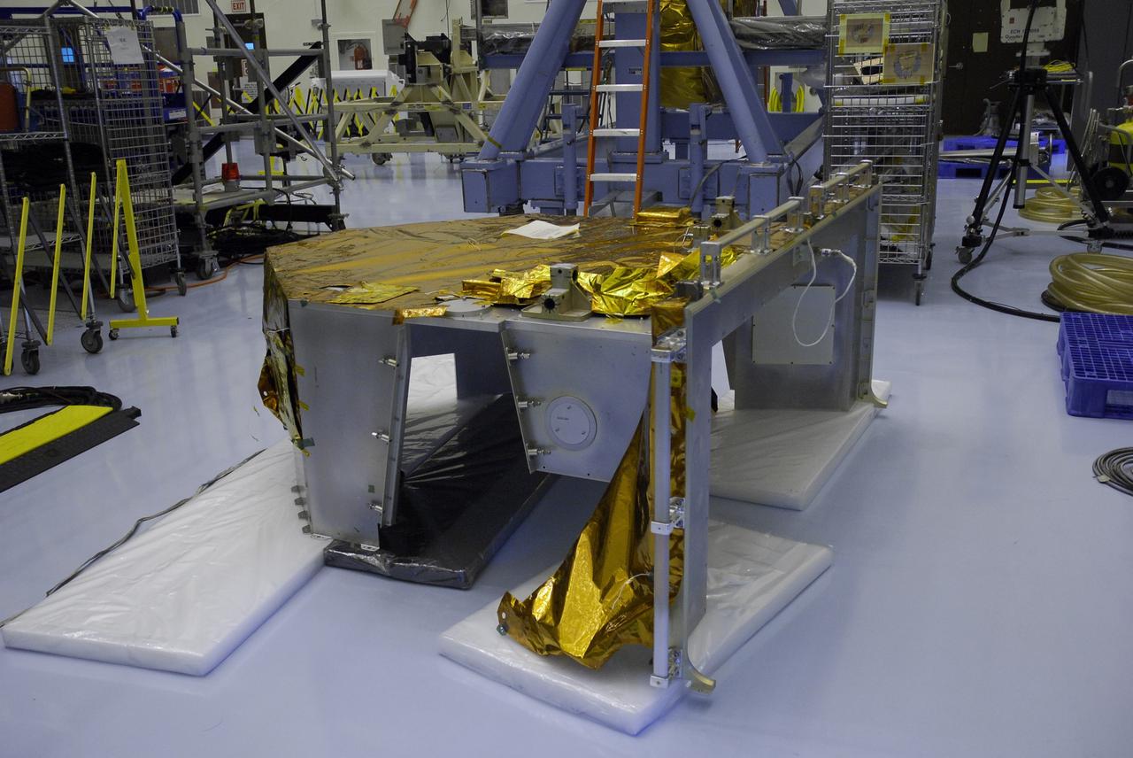 CAPE CANAVERAL, Fla. –   In the Payload Hazardous Servicing Facility at NASA's Kennedy Space Center, the Fine Guidance Sensor Scientific Instrument Protective Enclosure, or FSIPE, cover awaits a move to be installed on the Orbital Replacement Unit Carrier, or ORUC.   The ORUC is one of three carriers that are being prepared for the integration of telescope science instruments, both internal and external replacement components, as well as the flight support equipment to be used by the astronauts during the fifth and final Hubble servicing mission, STS-125.   Launch is targeted for Oct. 8. PHoto credit: NASA/Jack Pfaller