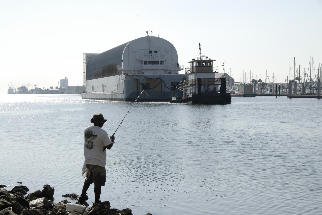 CAPE CANAVERAL, Fla. –   The Pegasus barge containing the external fuel tank for space shuttle Endeavour's STS-126 mission to the International Space Station is towed by a tugboat from Port Canaveral, Fla., for its trip on the Banana River to the Launch Complex 39 Area at NASA's Kennedy Space Center. The tank will be offloaded at the turn basin near the Vehicle Assembly Building and transported to the VAB.  There it will be lifted and lowered into a checkout cell. The STS-126 mission will deliver a Multi-Purpose Logistics Module to the International Space Station.  Launch is targeted for Nov. 10. Photo credit: NASA/Kim Shiflett