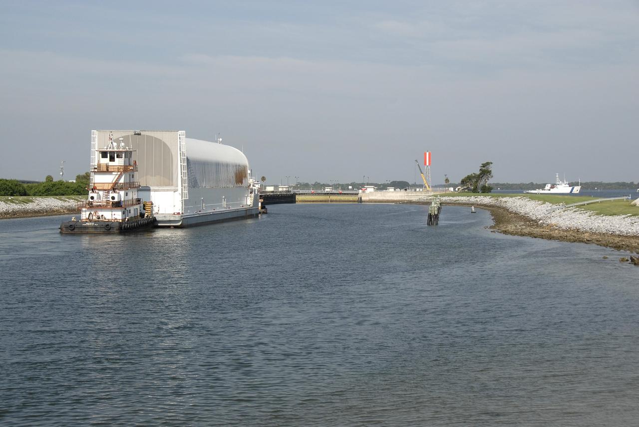 CAPE CANAVERAL, Fla. –   The Pegasus barge containing the external fuel tank for space shuttle Endeavour's STS-126 mission to the International Space Station is towed by a tugboat from Port Canaveral, Fla., for its trip on the Banana River to the Launch Complex 39 Area at NASA's Kennedy Space Center. The tank will be offloaded at the turn basin near the Vehicle Assembly Building and transported to the VAB.  There it will be lifted and lowered into a checkout cell. The STS-126 mission will deliver a Multi-Purpose Logistics Module to the International Space Station.  Launch is targeted for Nov. 10. Photo credit: NASA/Kim Shiflett