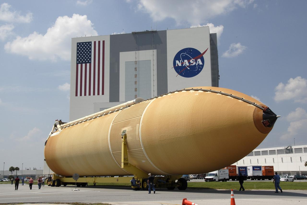 CAPE CANAVERAL, Fla. – The external fuel tank for space shuttle Endeavour's STS-126 mission to the International Space Station makes the turn toward the Vehicle Assembly Building, seen behind it, at NASA's Kennedy Space Center. The tank arrived earlier after a six-day ocean voyage towed by a solid rocket booster retrieval ship from the Michoud Assembly Facility near New Orleans. The tank will be transported to the VAB transfer aisle, lifted and lowered into a checkout cell. The STS-126 mission will deliver a Multi-Purpose Logistics Module to the International Space Station. Launch is targeted for Nov. 10. Photo credit: NASA/Kim Shiflett