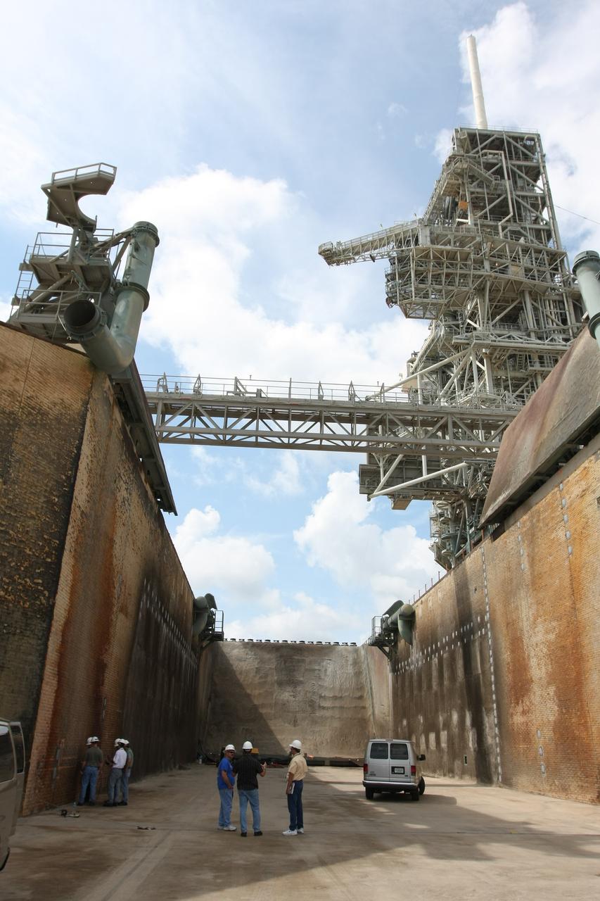 CAPE CANAVERAL, Fla. – This view of the Launch Pad 39A flame trench at NASA's Kennedy Space Center shows the areas on the walls recently repaired. Workers sprayed a heat-resistant concrete called Fondue Fyre into steel grid structures, welded to the wall of the flame trench. Fondue Fyre was developed during NASA's Apollo lunar program. Damage to the trench occurred during the launch of space shuttle Discovery on the STS-124 mission. A 75-foot by 20-foot section of the east wall was destroyed and debris scattered as far as the pad perimeter fence. Repairs being completed before the targeted Oct. 8 launch of Atlantis on the NASA Hubble Space Telescope servicing mission. Photo credit: NASA/Dimitri Gerondidakis