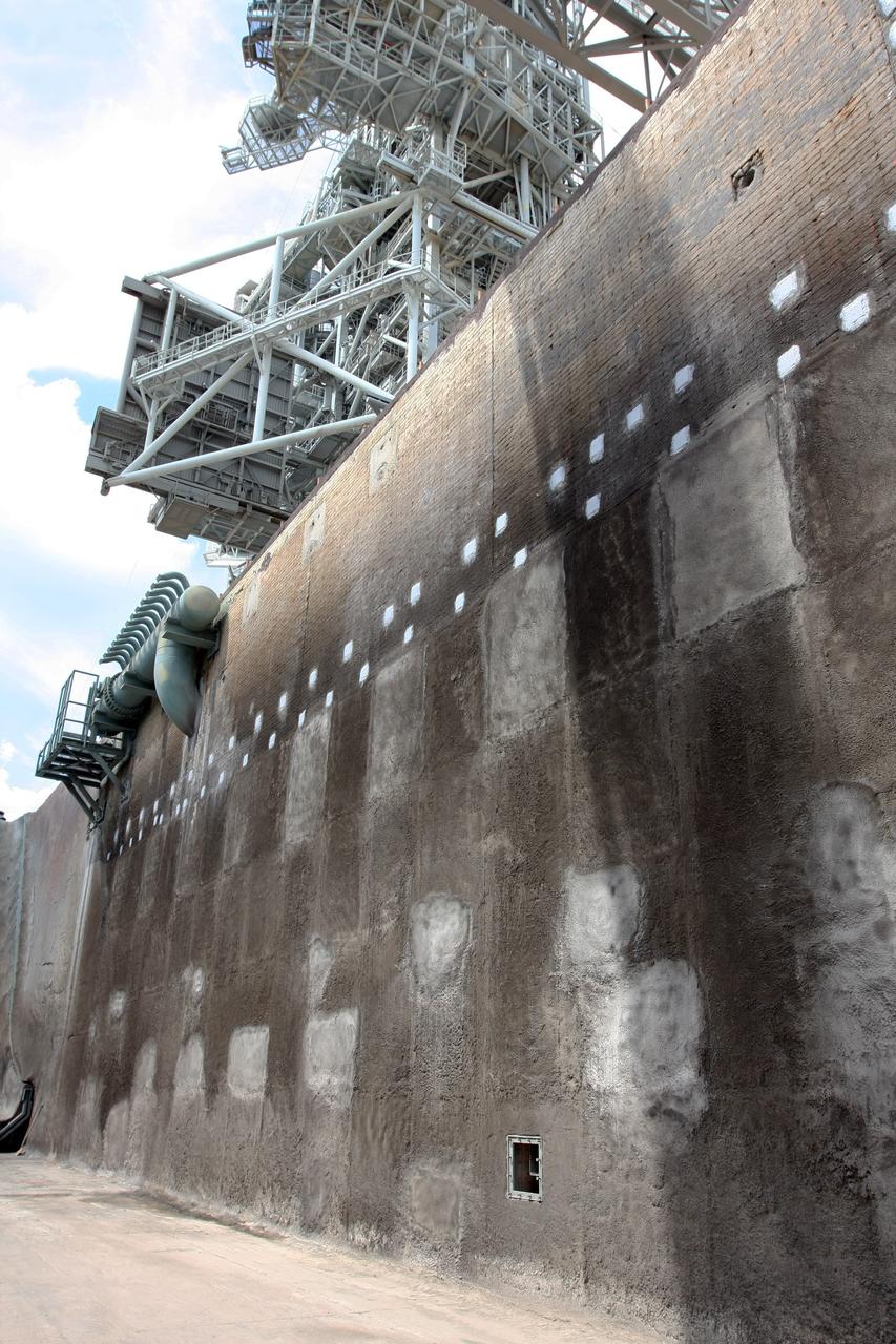 CAPE CANAVERAL, Fla. – A closeup of the wall in the Launch Pad 39A flame trench at NASA's Kennedy Space Center after repairs were made. Workers sprayed a heat-resistant concrete called Fondue Fyre into steel grid structures, welded to the wall of the flame trench. Fondue Fyre was developed during NASA's Apollo lunar program. Damage to the trench occurred during the launch of space shuttle Discovery on the STS-124 mission. A 75-foot by 20-foot section of the east wall was destroyed and debris scattered as far as the pad perimeter fence. Repairs being completed before the targeted Oct. 8 launch of Atlantis on the NASA Hubble Space Telescope servicing mission. Photo credit: NASA/Dimitri Gerondidakis
