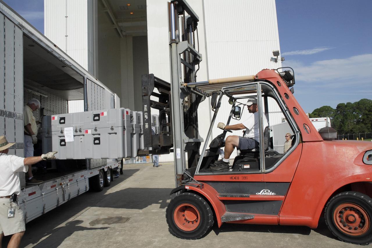 CAPE CANAVERAL, Fla. – At NASA's Kennedy Space Center, the Soft Capture and Rendezvous System, or SCRS, is offloaded from a truck. The SCRS will enable the future rendezvous, capture and safe disposal of Hubble by either a crewed or robotic mission. The SCRS greatly increases the current shuttle capture interfaces on Hubble, therefore significantly reducing the rendezvous and capture design complexities associated with the disposal mission. The SCRS comprises the Soft Capture Mechanism system and the Relative Navigation System and is part of the payload on the fifth and final Hubble servicing mission, STS-125, targeted for launch Oct. 8. Photo credit: NASA/Jack Pfaller