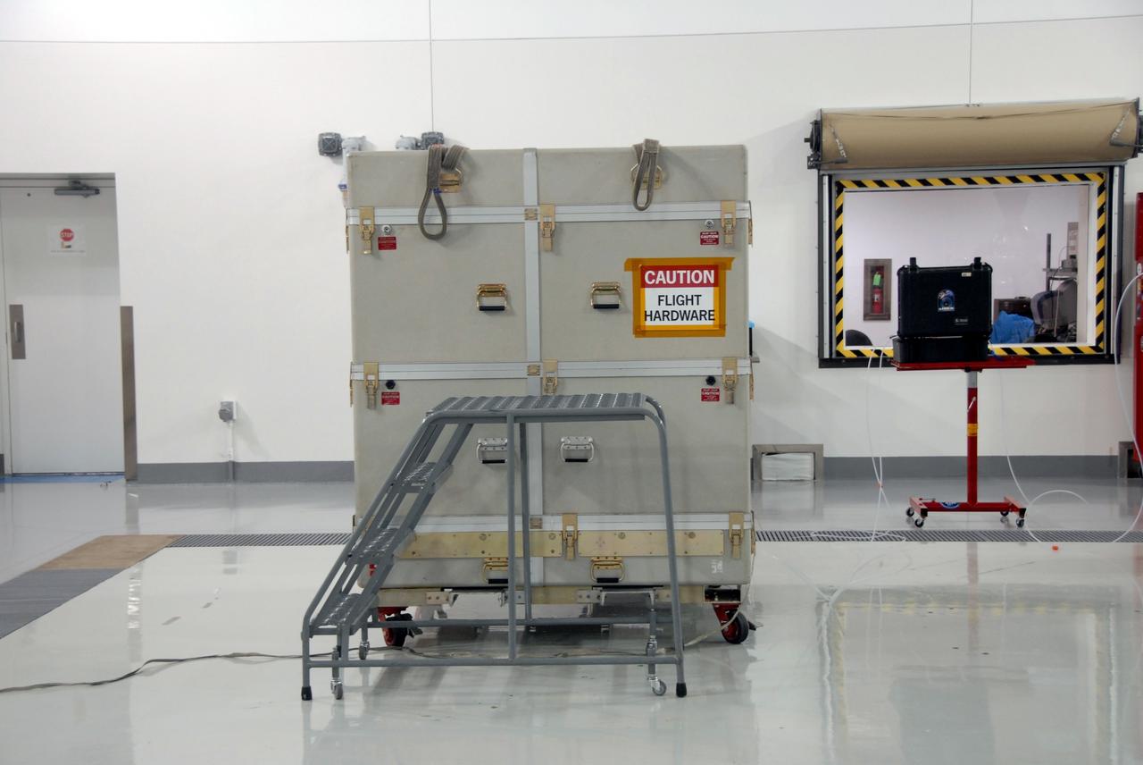 VANDENBERG AIR FORCE BASE, Calif. – At Vandenberg Air Force Base in California, the shipping container with NASA's Interstellar Boundary Explorer, or IBEX, mission spacecraft inside has arrived. The IBEX satellite will make the first map of the boundary between the Solar System and interstellar space. IBEX is the first mission designed to detect the edge of the Solar System. As the solar wind from the sun flows out beyond Pluto, it collides with the material between the stars, forming a shock front. IBEX contains two neutral atom imagers designed to detect particles from the termination shock at the boundary between the Solar System and interstellar space. IBEX also will study galactic cosmic rays, energetic particles from beyond the Solar System that pose a health and safety hazard for humans exploring beyond Earth orbit. IBEX will make these observations from a highly elliptical orbit that takes it beyond the interference of the Earth's magnetosphere. IBEX is targeted for launch from the Pegasus XL rocket on Oct. 5. Photo credit: NASA/Mark Mackley