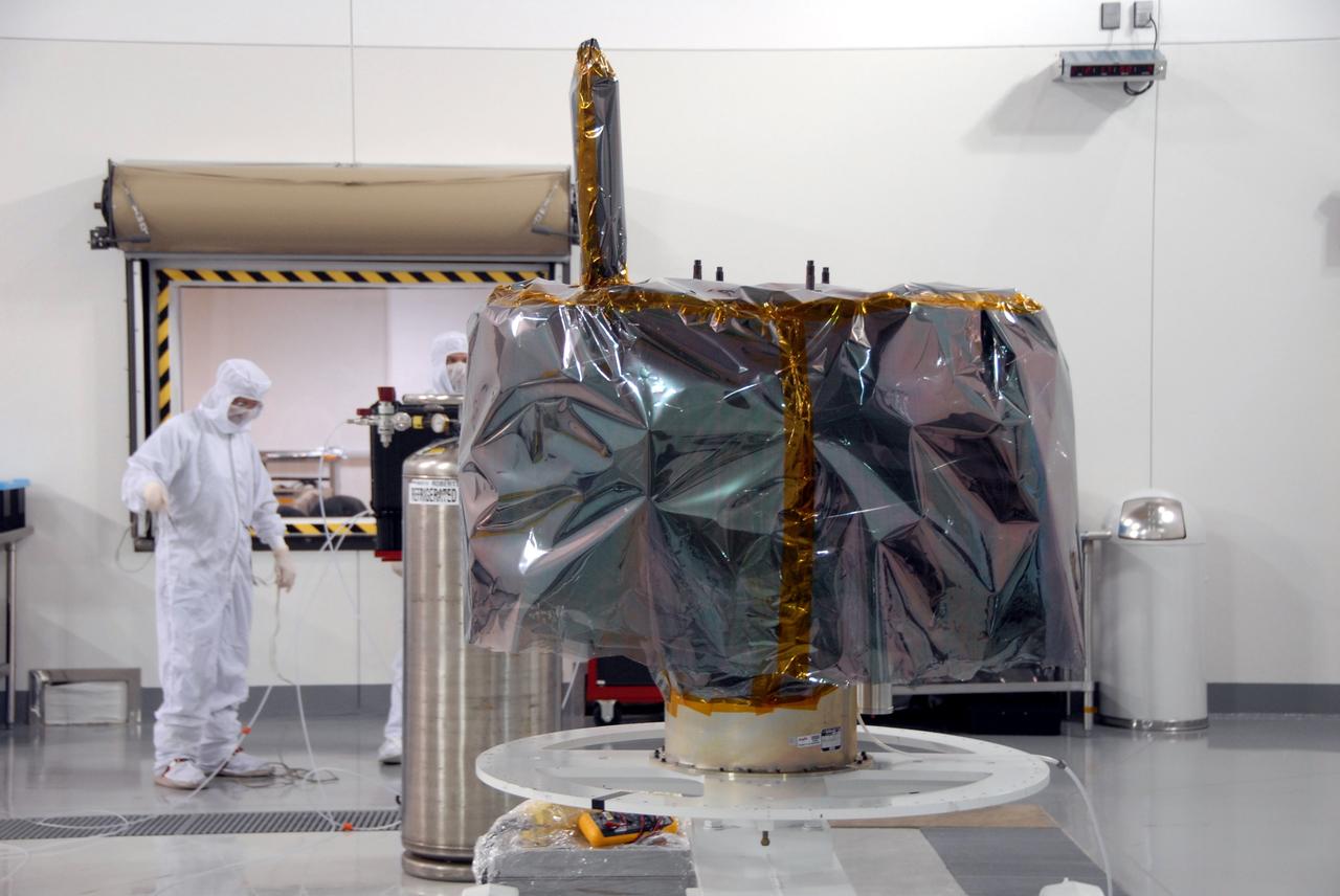 VANDENBERG AIR FORCE BASE, Calif. – At Vandenberg Air Force Base in California, NASA's Interstellar Boundary Explorer, or IBEX, mission spacecraft rests securely on the mobile stand. The IBEX satellite will make the first map of the boundary between the Solar System and interstellar space. IBEX is the first mission designed to detect the edge of the Solar System. As the solar wind from the sun flows out beyond Pluto, it collides with the material between the stars, forming a shock front. IBEX contains two neutral atom imagers designed to detect particles from the termination shock at the boundary between the Solar System and interstellar space. IBEX also will study galactic cosmic rays, energetic particles from beyond the Solar System that pose a health and safety hazard for humans exploring beyond Earth orbit. IBEX will make these observations from a highly elliptical orbit that takes it beyond the interference of the Earth's magnetosphere. IBEX is targeted for launch from the Pegasus XL rocket on Oct. 5. Photo credit: NASA