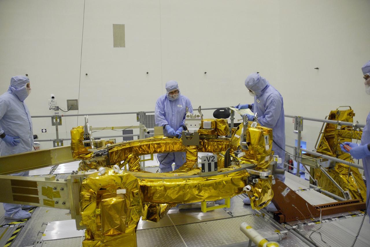 CAPE CANAVERAL, Fla. – In the Payload Hazardous Servicing Facility at NASA's Kennedy Space Center, technicians prepare the Flight Support System, or FSS, carrier to receive the Soft Capture Mechanism (SCM), part of the Soft Capture and Rendezvous System, or SCRS. The SCRS will enable the future rendezvous, capture and safe disposal of NASA's Hubble Space Telescope by either a crewed or robotic mission. The ring-like device attaches to Hubble’s aft bulkhead. The SCRS greatly increases the current shuttle capture interfaces on Hubble, therefore significantly reducing the rendezvous and capture design complexities associated with the disposal mission. The FSS will join the Multi-Use Lightweight Equipment, or MULE, carrier, the Super Lightweight Interchangeable Carrier and the Orbital Replacement Unit Carrier as payload on space shuttle Atlantis's STS-125 mission. The payload is scheduled to go to Launch Pad 39A in mid-September to be installed into Atlantis' payload bay. Atlantis is targeted to launch Oct. 8 at 1:34 a.m. EDT. Photo credit: NASA/Troy Cryder