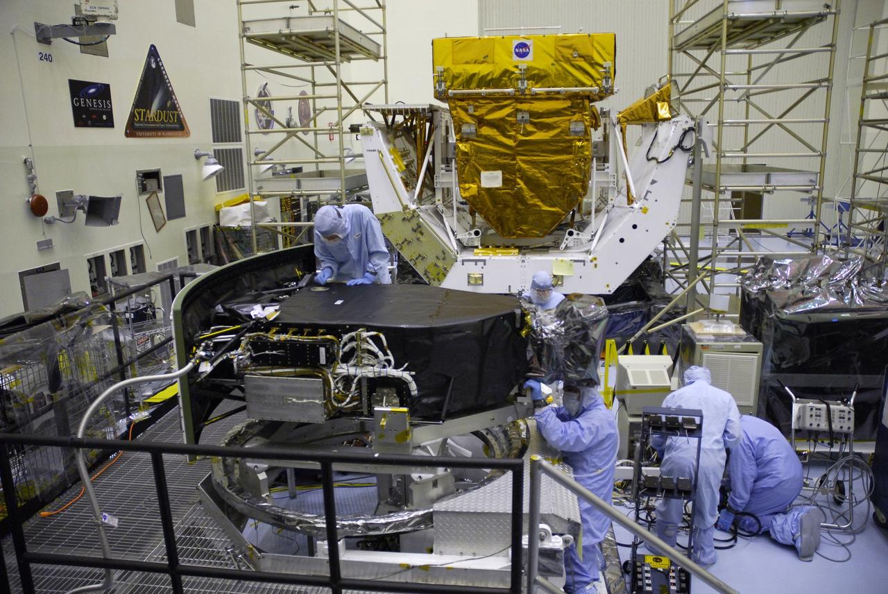CAPE CANAVERAL, Fla. –  Technicians in the Payload Hazardous Servicing Facility complete removal of the protective cover from the Wide Field Camera 3, or WFC3.  The WFC3 is part of the payload on space shuttle Atlantis for the fifth and final Hubble servicing mission, STS-125.  As Hubble enters the last stage of its life, WFC3 will be Hubble's next evolutionary step, allowing Hubble to peer ever further into the mysteries of the cosmos. WFC3 will study a diverse range of objects and phenomena, from young and extremely distant galaxies, to much more nearby stellar systems, to objects within our very own solar system. WFC3 will take the place of Wide Field Planetary Camera 2, which astronauts will bring back to Earth aboard the shuttle. Launch of Atlantis is targeted at 1:34 a.m. EDT Oct. 8.  Photo credit: NASA/Jack Pfaller