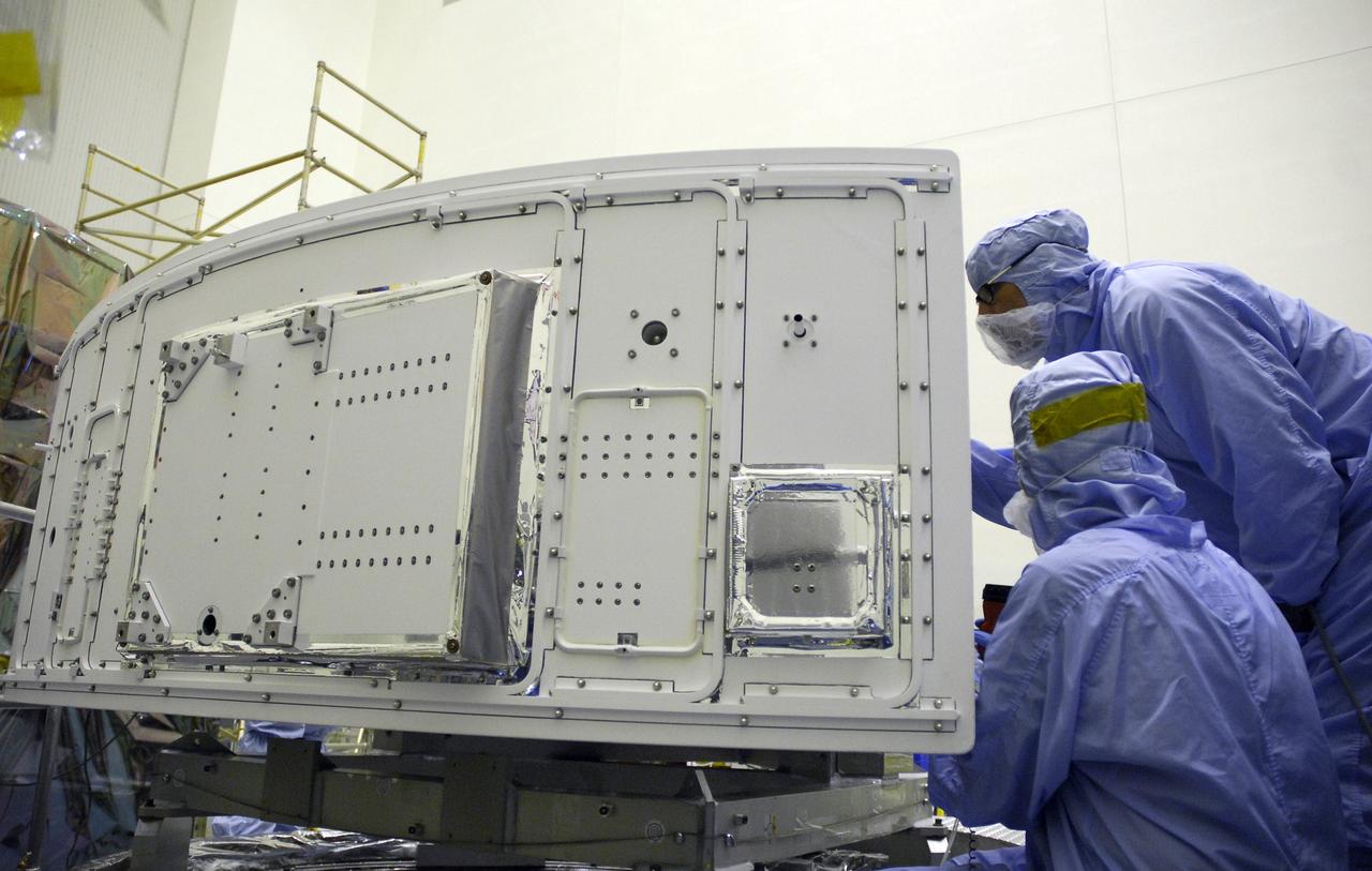 CAPE CANAVERAL, Fla. –   In the Payload Hazardous Servicing Facility at NASA's Kennedy Space Center, a technicians clean the radiator on the Wide Field Camera 3, or WFC3,that will be installed on NASA's Hubble Space Telescope.  The radiator is the "outside" of WFC3 that will be exposed to space. It will expel heat out of Hubble and into space through black body radiation. WFC3 is part of the payload on space shuttle Atlantis' STS-125 mission for the fifth and final Hubble servicing flight to NASA's Hubble Space Telescope.  As Hubble enters the last stage of its life, WFC3 will be Hubble's next evolutionary step, allowing Hubble to peer ever further into the mysteries of the cosmos. WFC3 will study a diverse range of objects and phenomena, from young and extremely distant galaxies, to much more nearby stellar systems, to objects within our very own solar system. WFC3 will take the place of Wide Field Planetary Camera 2, which astronauts will bring back to Earth aboard the shuttle. Launch of Atlantis is targeted at 1:34 a.m. EDT Oct. 8.  Photo credit: NASA/Amanda Diller