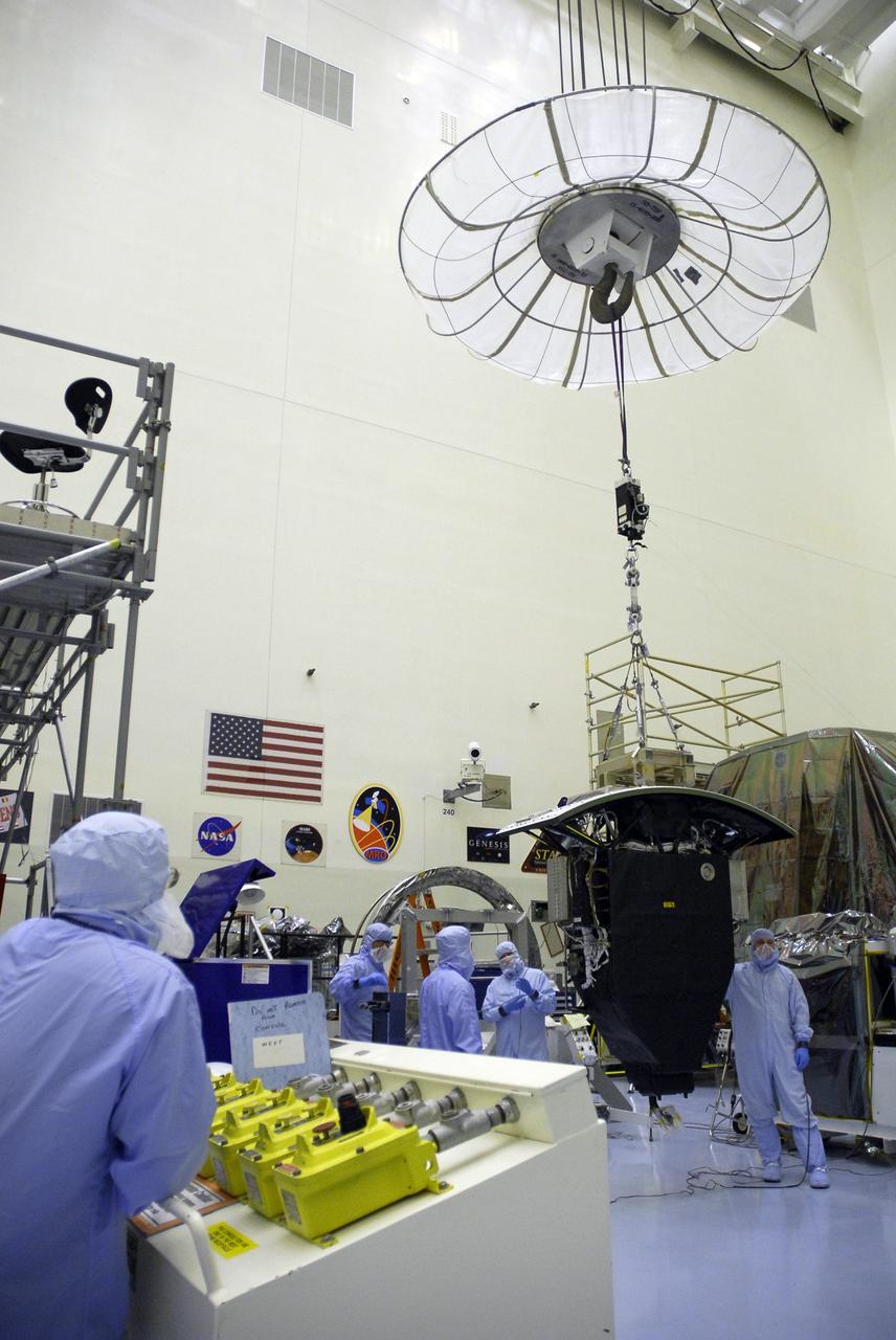 CAPE CANAVERAL, Fla. –  In the Payload Hazardous Servicing Facility at NASA's Kennedy Space Center, an overhead crane moves the Wide Field Camera 3, or WFC3, from its stand. The WFC3 will be transferred to the Super Lightweight Interchangeable Carrier.  WFC3 is part of the payload on space shuttle Atlantis' STS-125 mission for the fifth and final Hubble servicing flight to NASA's Hubble Space Telescope. As Hubble enters the last stage of its life, WFC3 will be Hubble's next evolutionary step, allowing Hubble to peer ever further into the mysteries of the cosmos. WFC3 will study a diverse range of objects and phenomena, from young and extremely distant galaxies, to much more nearby stellar systems, to objects within our very own solar system. WFC3 will take the place of Wide Field Planetary Camera 2, which astronauts will bring back to Earth aboard the shuttle. Launch of Atlantis is targeted at 1:34 a.m. EDT Oct. 8.  Photo credit: NASA/Amanda Diller