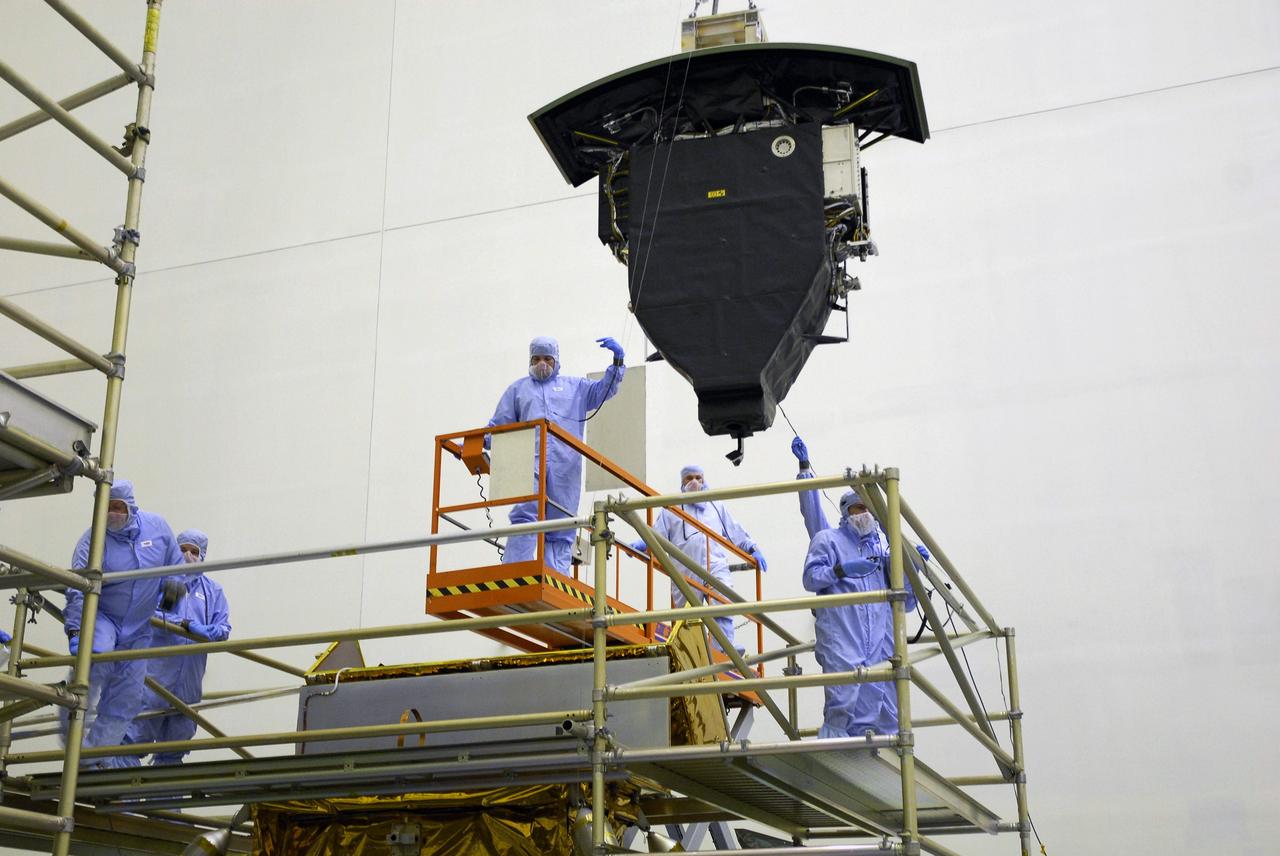 CAPE CANAVERAL, Fla. –   In the Payload Hazardous Servicing Facility at NASA's Kennedy Space Center, the Wide Field Camera 3, or WFC3, is moved toward the Super Lightweight Interchangeable Carrier.  WFC3 is part of the payload on space shuttle Atlantis' STS-125 mission for the fifth and final Hubble servicing flight to NASA's Hubble Space Telescope.  As Hubble enters the last stage of its life, WFC3 will be Hubble's next evolutionary step, allowing Hubble to peer ever further into the mysteries of the cosmos. WFC3 will study a diverse range of objects and phenomena, from young and extremely distant galaxies, to much more nearby stellar systems, to objects within our very own solar system. WFC3 will take the place of Wide Field Planetary Camera 2, which astronauts will bring back to Earth aboard the shuttle. Launch of Atlantis is targeted at 1:34 a.m. EDT Oct. 8.  Photo credit: NASA/Amanda Diller