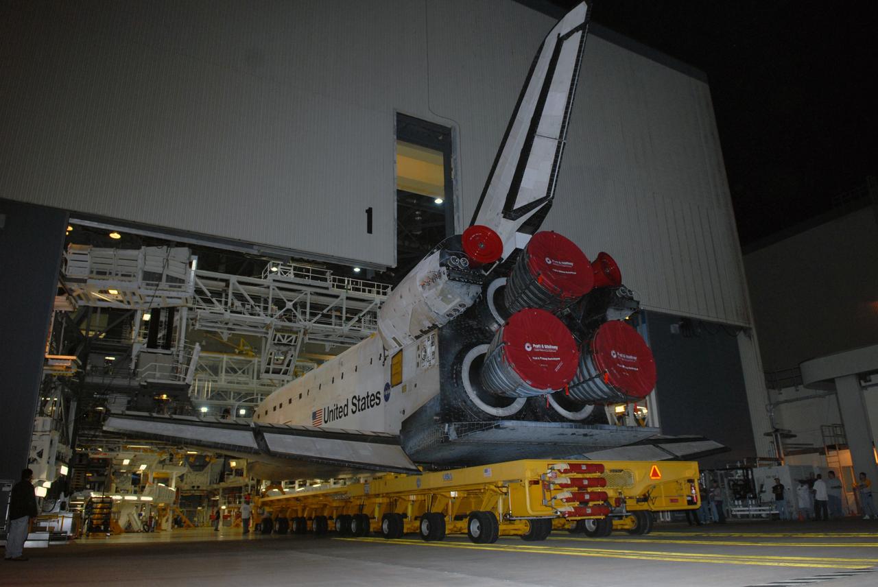 CAPE CANAVERAL, Fla. – Space shuttle Atlantis rolls out of the Orbiter Processing Facility bay 1 at NASA's Kennedy Space Center for transfer to the Vehicle Assembly Building. In the VAB, Atlantis will be attached to its external fuel tank and twin solid rocket boosters. After additional preparations are made, the shuttle will be rolled out to Launch Pad 39A to prepare for launch on the STS-125 mission targeted for Oct. 8. Photo credit: NASA/Jack Pfaller