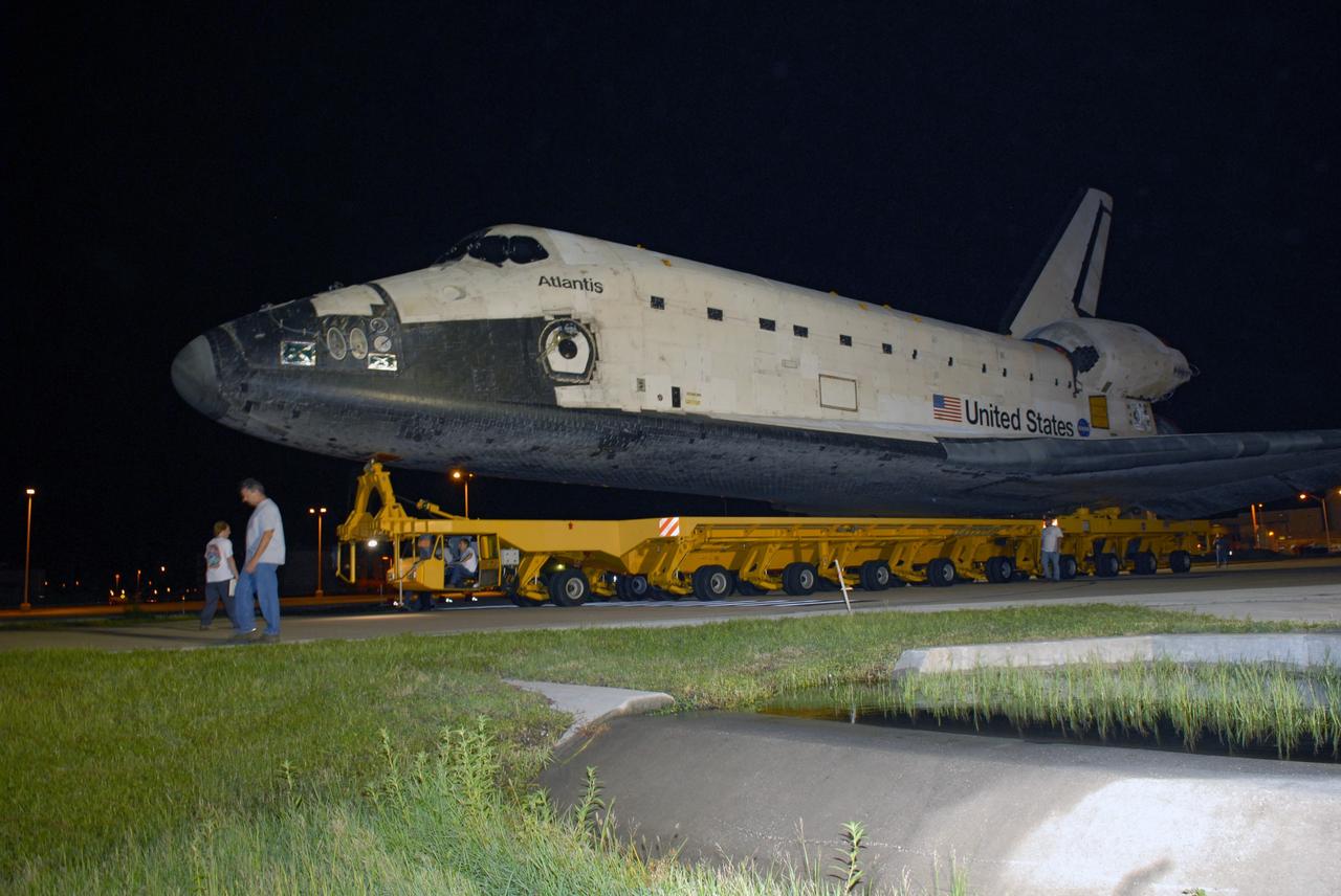 CAPE CANAVERAL, Fla. – After rolling out of the Orbiter Processing Facility bay 1 at NASA's Kennedy Space Center, space shuttle Atlantis rolls to the Vehicle Assembly Building. In the VAB, Atlantis will be attached to its external fuel tank and twin solid rocket boosters. After additional preparations are made, the shuttle will be rolled out to Launch Pad 39A to prepare for launch on the STS-125 mission targeted for Oct. 8. Photo credit: NASA/Jack Pfaller