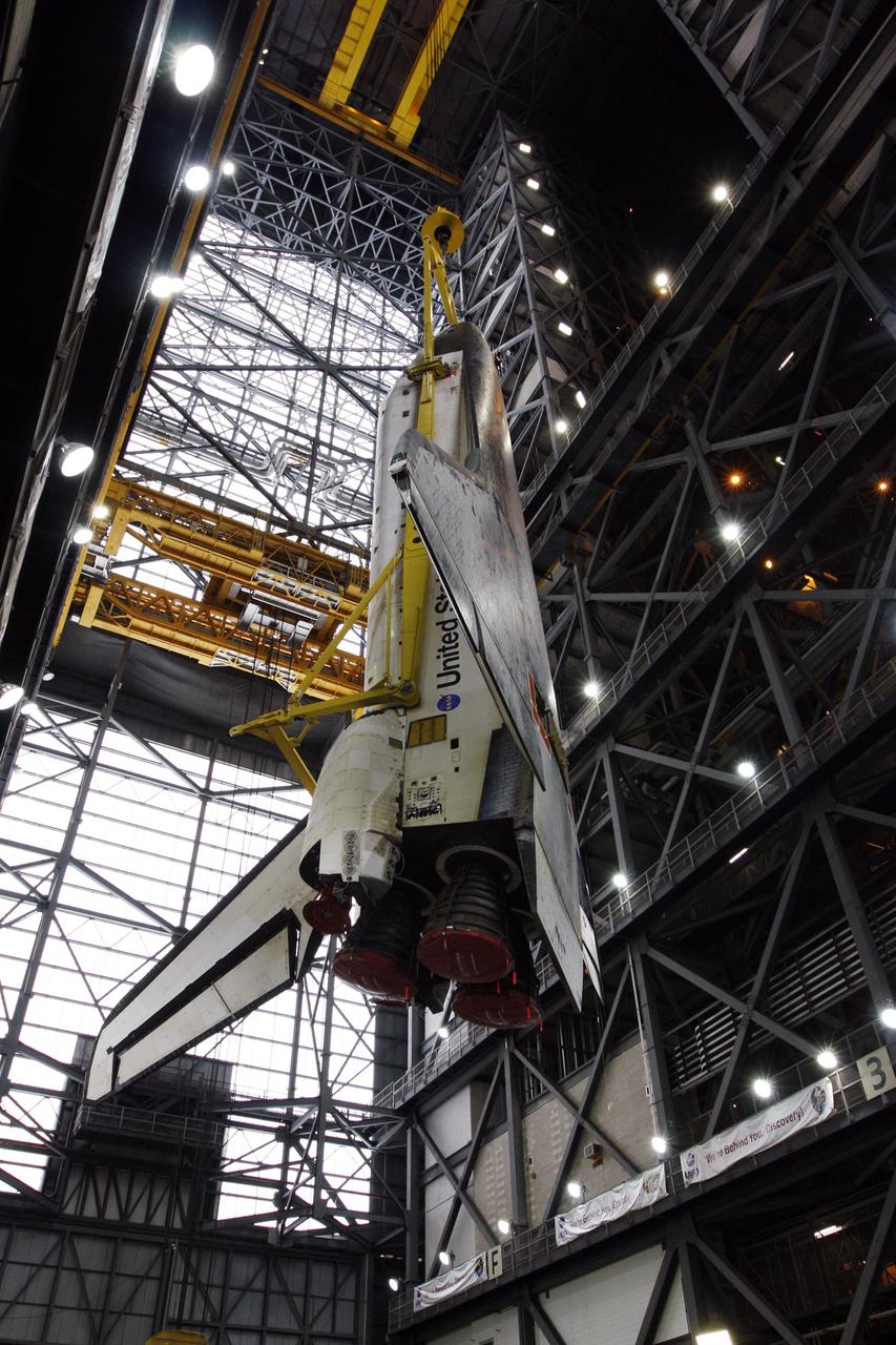 CAPE CANAVERAL, Fla. –   A crane lifts space shuttle Atlantis into the upper levels of the Vehicle Assembly Building at NASA's Kennedy Space Center.  The shuttle will be moved into high bay 3 and lowered for stacking with its external fuel tank and twin solid rocket boosters. After additional preparations are made, the shuttle will be rolled out to Launch Pad 39A to prepare for launch on the STS-125 mission targeted for 1:34 a.m. EDT Oct. 8. Photo credit: NASA/Dimitri Gerondidakis