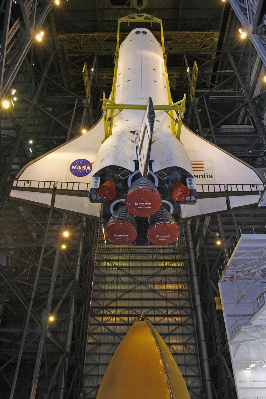 CAPE CANAVERAL, Fla. – In the Vehicle Assembly Building at NASA's Kennedy Space Center, space shuttle Atlantis is lowered toward the external fuel tank in high bay 3. Atlantis will be mated to the tank and twin solid rocket boosters stacked on the mobile launcher platform. After additional preparations are made, the shuttle will be rolled out to Launch Pad 39A to prepare for launch on the STS-125 mission targeted for 1:34 a.m. EDT Oct. 8. Photo credit: NASA/Dimitri Gerondidakis