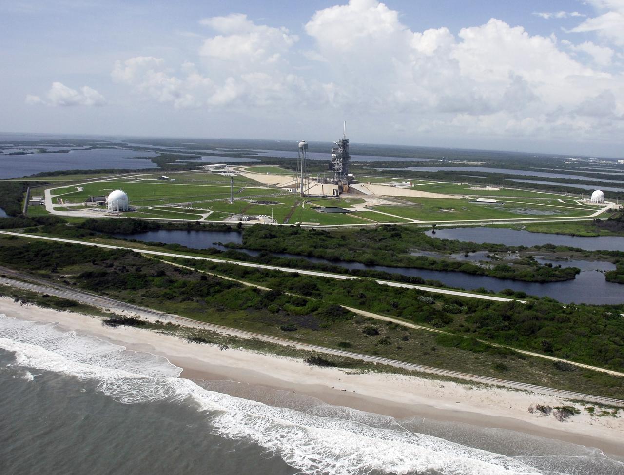 CAPE CANAVERAL, Fla. –  Launch Pad 39A seems to be an island in the high water surrounding it caused by Tropical Storm Fay. In the distance is the Atlantic Ocean.  The storm passed over the center Aug. 20 and then stalled offshore, bringing with it heavy rain and tropical storm force wind.  Kennedy closed Aug. 19 because of Fay and reopened for normal operations Aug. 22.  Based on initial assessments, there was no damage to space flight hardware, such as the space shuttles and Hubble Space Telescope equipment. Some facilities did sustain minor damage.   Photo credit: NASA/Amanda Diller