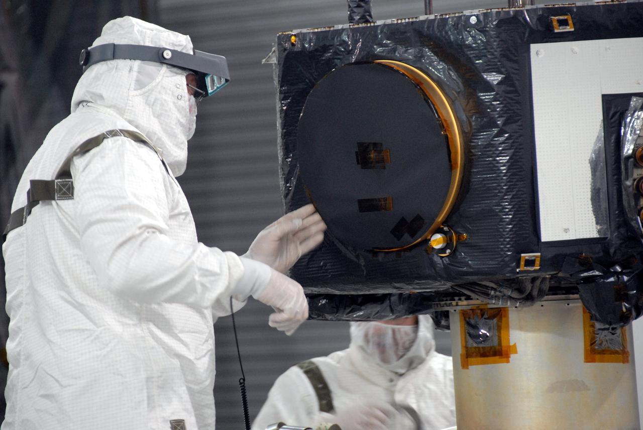 VANDENBERG AIR FORCE BASE, Calif. - At Vandenberg Air Force Base in California, a technician checks NASA's Interstellar Boundary Explorer, or IBEX, spacecraft undergoing spin balance testing. The IBEX satellite will make the first map of the boundary between the Solar System and interstellar space. IBEX is the first mission designed to detect the edge of the Solar System. As the solar wind from the sun flows out beyond Pluto, it collides with the material between the stars, forming a shock front. IBEX contains two neutral atom imagers designed to detect particles from the termination shock at the boundary between the Solar System and interstellar space. IBEX also will study galactic cosmic rays, energetic particles from beyond the Solar System that pose a health and safety hazard for humans exploring beyond Earth orbit. IBEX will make these observations from a highly elliptical orbit that takes it beyond the interference of the Earth's magnetosphere. IBEX is targeted for launch from a Pegasus XL rocket on Oct. 5. Photo credit: NASA/VAFB