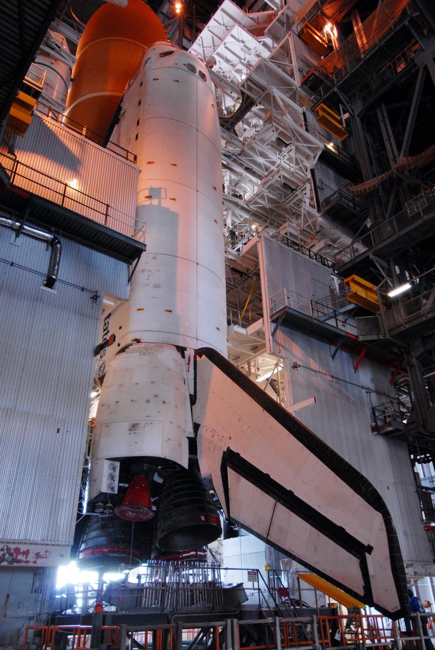 CAPE CANAVERAL, Fla. – Space shuttle Atlantis stands ready in the Vehicle Assembly Building at NASA’s Kennedy Space Center for the pending rollout to Launch Pad 39A. Visible behind Atlantis (upper left) is the external fuel tank. The Sept. 2 rollout date was postponed due to Tropical Storm Hanna’s shift to a northern track.  Managers are closely following Hanna to determine when would be the best time this week to move space shuttle Atlantis to its launch pad. The tentative rollout time is 10 a.m. Sept. 4, depending on the track Hanna follows along the Florida coast. Atlantis is scheduled to launch on the STS-125 mission to service NASA’s Hubble Space Telescope.  Launch is targeted for Oct. 8.   Photo credit: NASA/Jack Pfaller