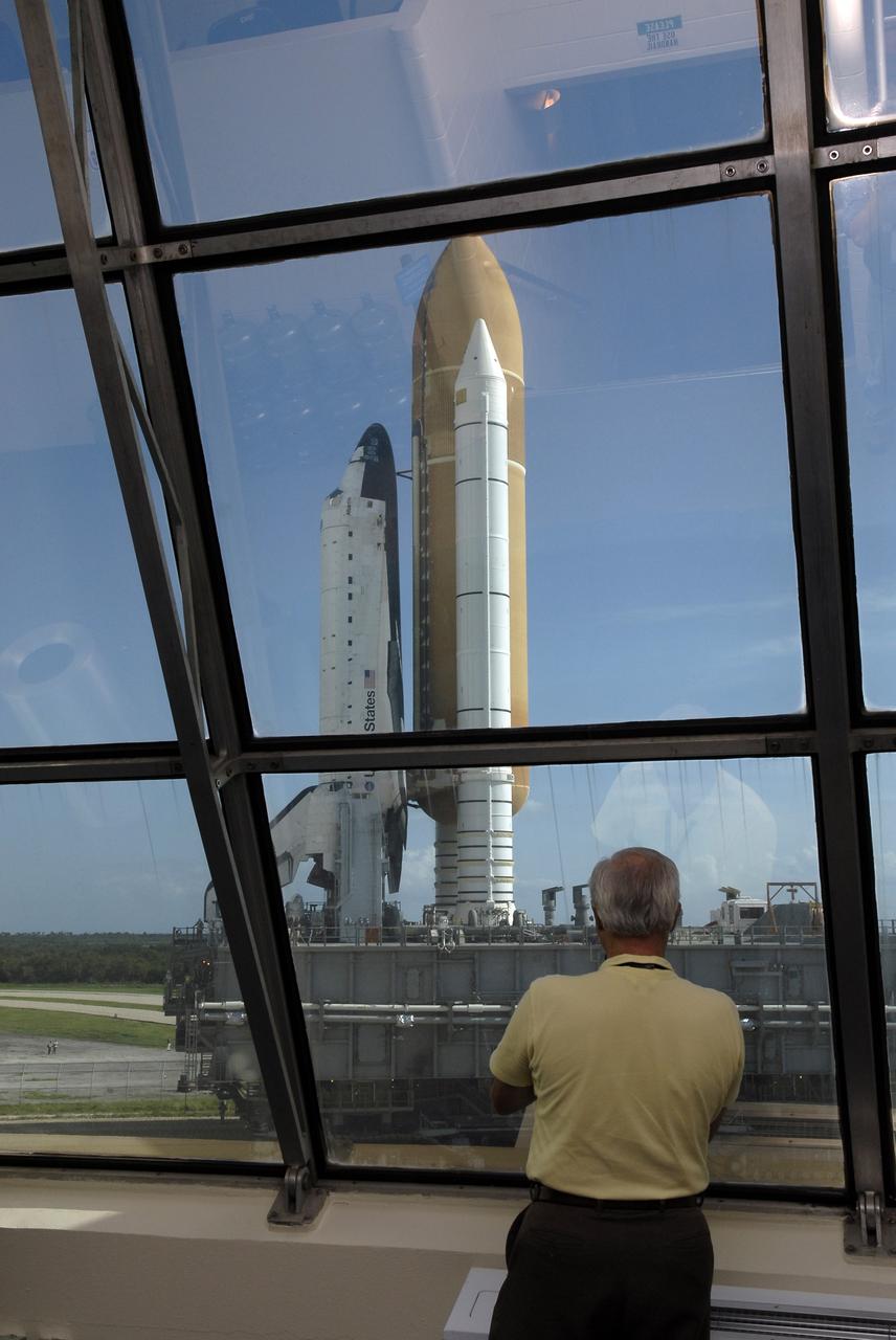 CAPE CANAVERAL, Fla. –  Rollout of space shuttle Atlantis is viewed from inside the Launch Control Center at NASA's Kennedy Space Center.  The shuttle stack, with solid rocket boosters and external fuel tank attached to Atlantis, rest on the mobile launcher platform.  Movement is provided by the crawler-transporter underneath.  First motion occurred at 9:19 a.m. EDT. The Sept. 2 rollout date was postponed due to Tropical Storm Hanna’s shift to a northern track. Atlantis is scheduled to launch on the STS-125 mission to service NASA’s Hubble Space Telescope.  Launch is targeted for Oct. 8.  Photo credit: NASA/Kim Shiflett