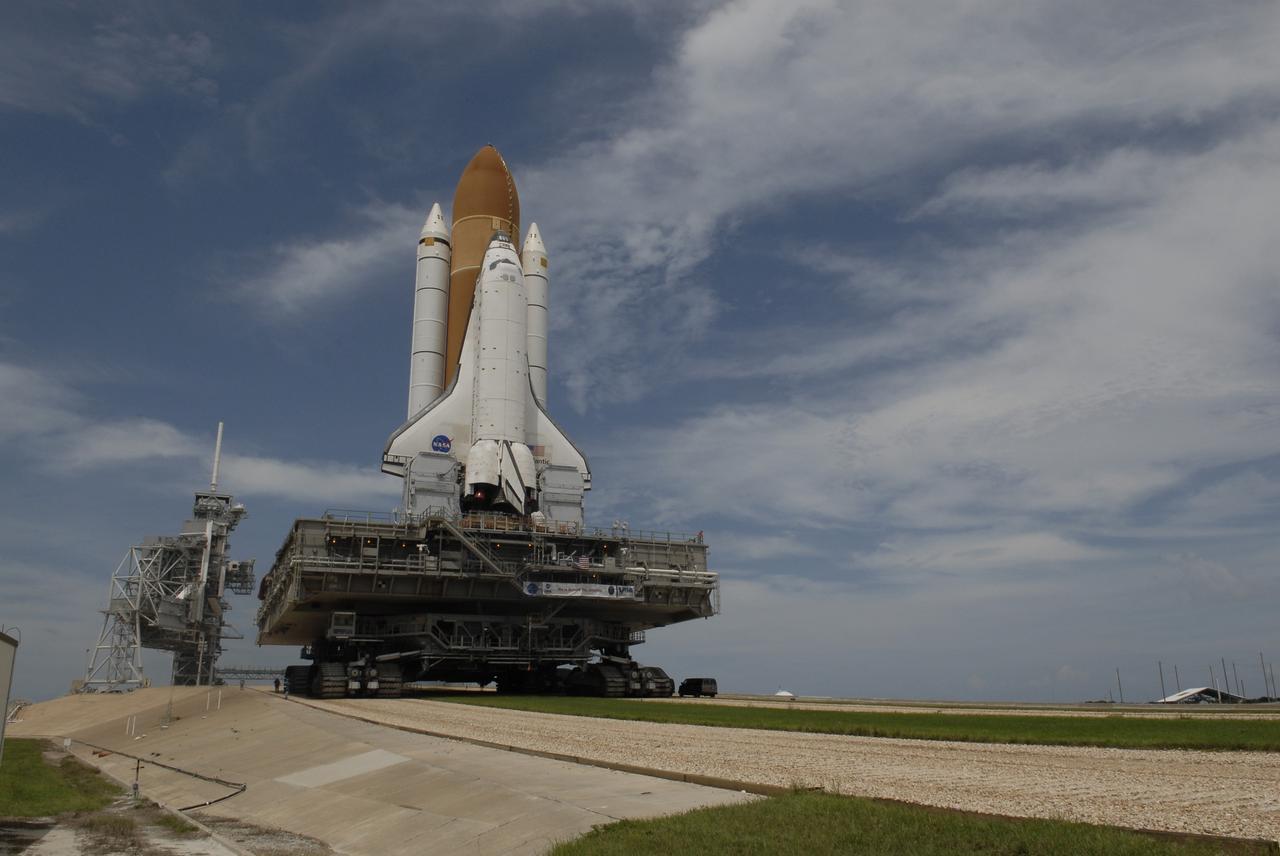CAPE CANAVERAL, Fla. –  Space shuttle Atlantis approaches the top of Launch Pad 39A at NASA's Kennedy Space Center after rolling from the Vehicle Assembly Building. First motion occurred at 9:19 a.m. EDT and Atlantis was hard down on the pad at 3:52 p.m.. The shuttle stack, with solid rocket boosters and external fuel tank attached to Atlantis, rest on the mobile launcher platform.  Movement is provided by the crawler-transporter underneath.  The Sept. 2 rollout date was postponed due to Tropical Storm Hanna’s shift to a northern track. Atlantis is scheduled to launch on the STS-125 mission to service NASA’s Hubble Space Telescope.  Launch is targeted for Oct. 8.  Photo credit: NASA/Kim Shiflett