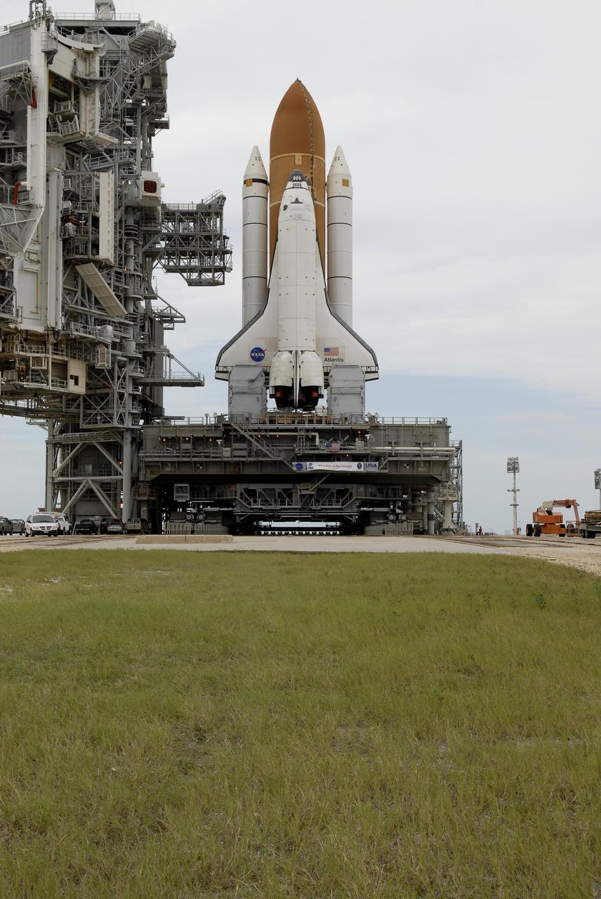 CAPE CANAVERAL, Fla. – Space shuttle Atlantis comes to a stop on the top of Launch Pad 39A at NASA's Kennedy Space Center after more than a 6-hour journey from the Vehicle Assembly Building. First motion occurred at 9:19 a.m. EDT and Atlantis was hard down on the pad at 3:52 p.m. The shuttle stack, with solid rocket boosters and external fuel tank attached to Atlantis, rest on the mobile launcher platform. Movement is provided by the crawler-transporter underneath. The Sept. 2 rollout date was postponed due to Tropical Storm Hanna’s shift to a northern track. Atlantis is scheduled to launch on the STS-125 mission to service NASA’s Hubble Space Telescope. Launch is targeted for Oct. 8. Photo credit: NASA/Kim Shiflett