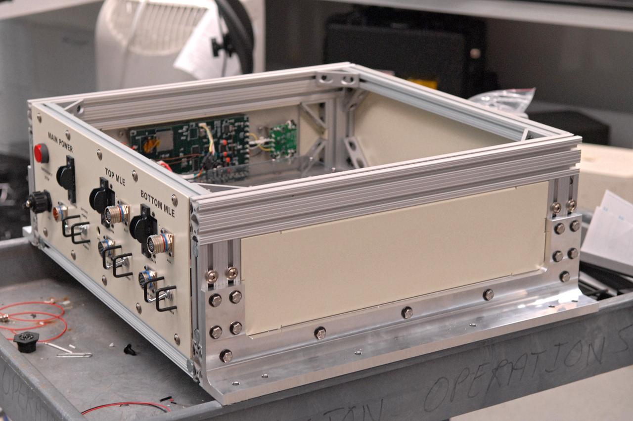 CAPE CANAVERAL, Fla. – In the Life Science Building at NASA's Kennedy Space Center, a space experiment rack is under development for flight aboard NASA's first commercially-provided research flights on Zero Gravity Corporation's reduced gravity aircraft. Known as the FASTRACK Space Experiment Platform, the rack is designed to support two standard lockers that fit inside the space shuttle's crew middeck. It is being developed jointly by Kennedy and Space Florida to facilitate NASA and commercial use of reusable U.S. suborbital flight vehicles currently under development. FASTRACK will enable investigators to test experiments, apparatus and analytical techniques in hardware compatible with the International Space Station, and to perform science that can be carried out during the reduced gravity available for brief periods during aircraft parabolas. Flight testing of the FASTRACK will be performed on four consecutive days between September 9-12 from Ellington Field near NASA's Johnson Space Center, Houston. Photo credit: NASA/Troy Cryder