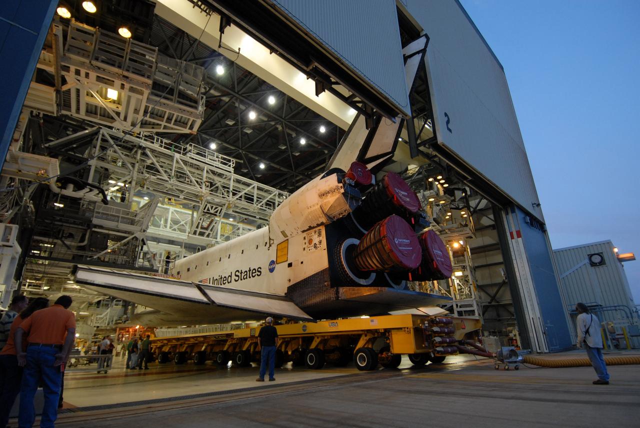 CAPE CANAVERAL, Fla. – Space shuttle Endeavour begins rolling out of Orbiter Processing Facility 2 to head to the Vehicle Assembly Building at NASA's Kennedy Space Center. First motion was 7:01 a.m. EDT. In the VAB, Endeavour will be attached to its external fuel tank and twin solid rocket boosters. After additional preparations are made, the shuttle will be rolled out to Launch Pad 39B. Endeavour is the backup shuttle, if needed for rescue, for space shuttle Atlantis’ STS-125 mission to NASA’s Hubble Space Telescope targeted for October. Photo credit: NASA/Troy Cryder